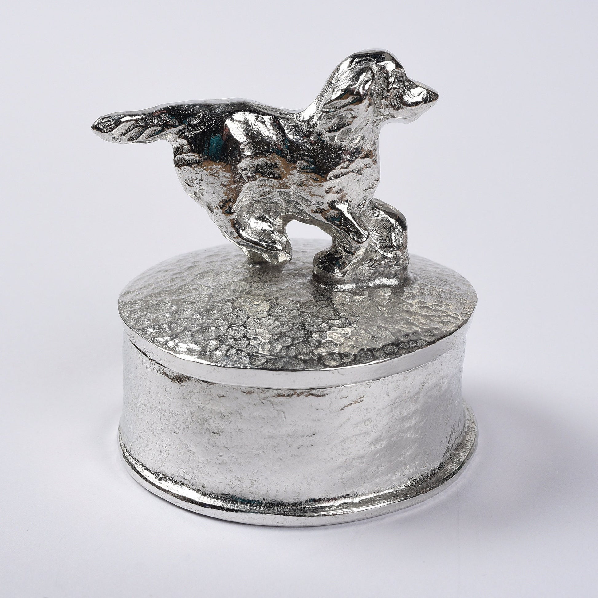 Spaniel pewter personalised trinket box. Our round spaniel keepsake box features a running springer spaniel sculpture as a handle. The underside of the lid can be engraved with your personalised message. Dog gifts, personalised gifts for dog lovers.