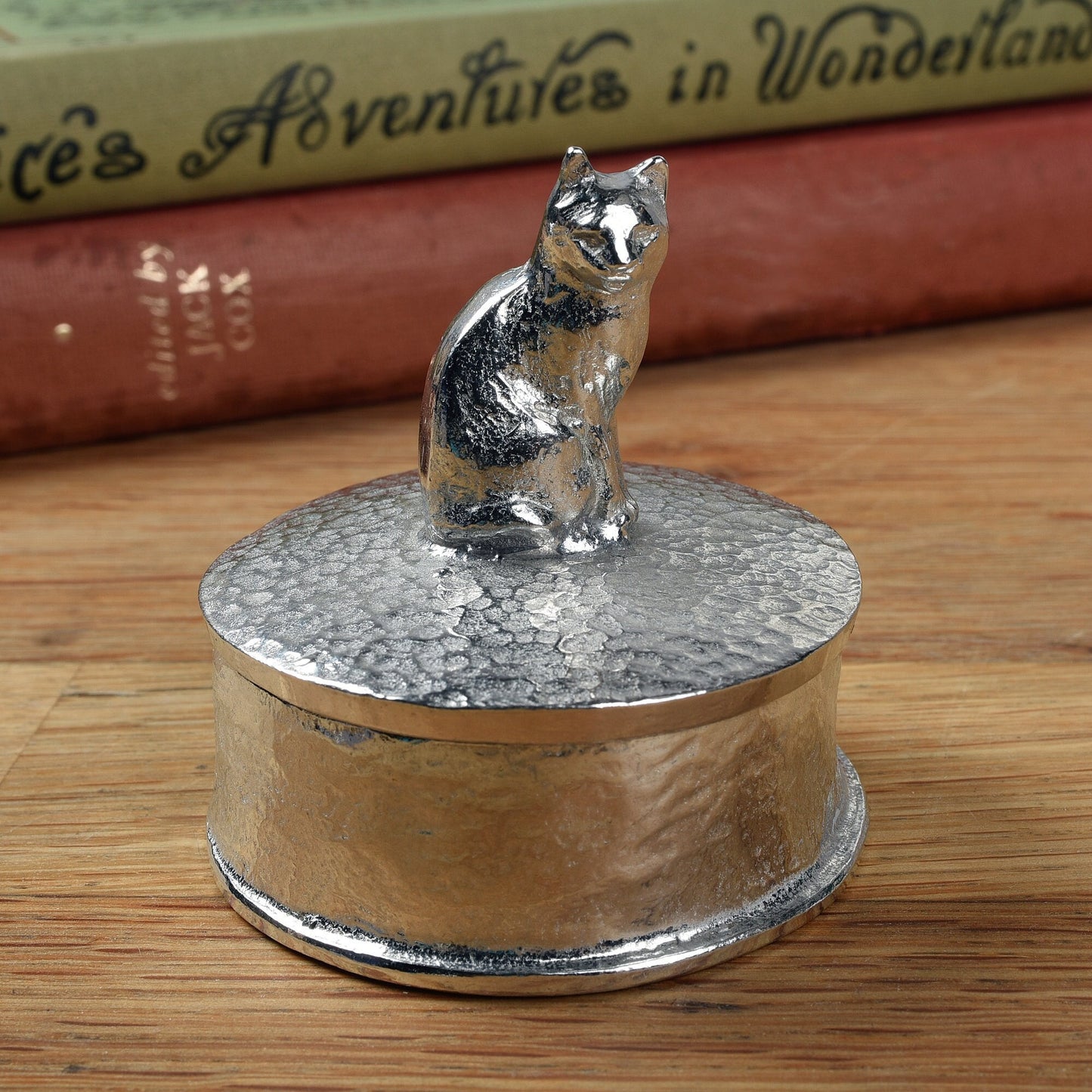 Cat pewter personalised trinket box. Our round cat keepsake box features a cat sculpture as a handle. The underside of the lid can be engraved with your personalised message. Cat gifts, personalised gifts for cat lovers. Country gifts, made in Britain.