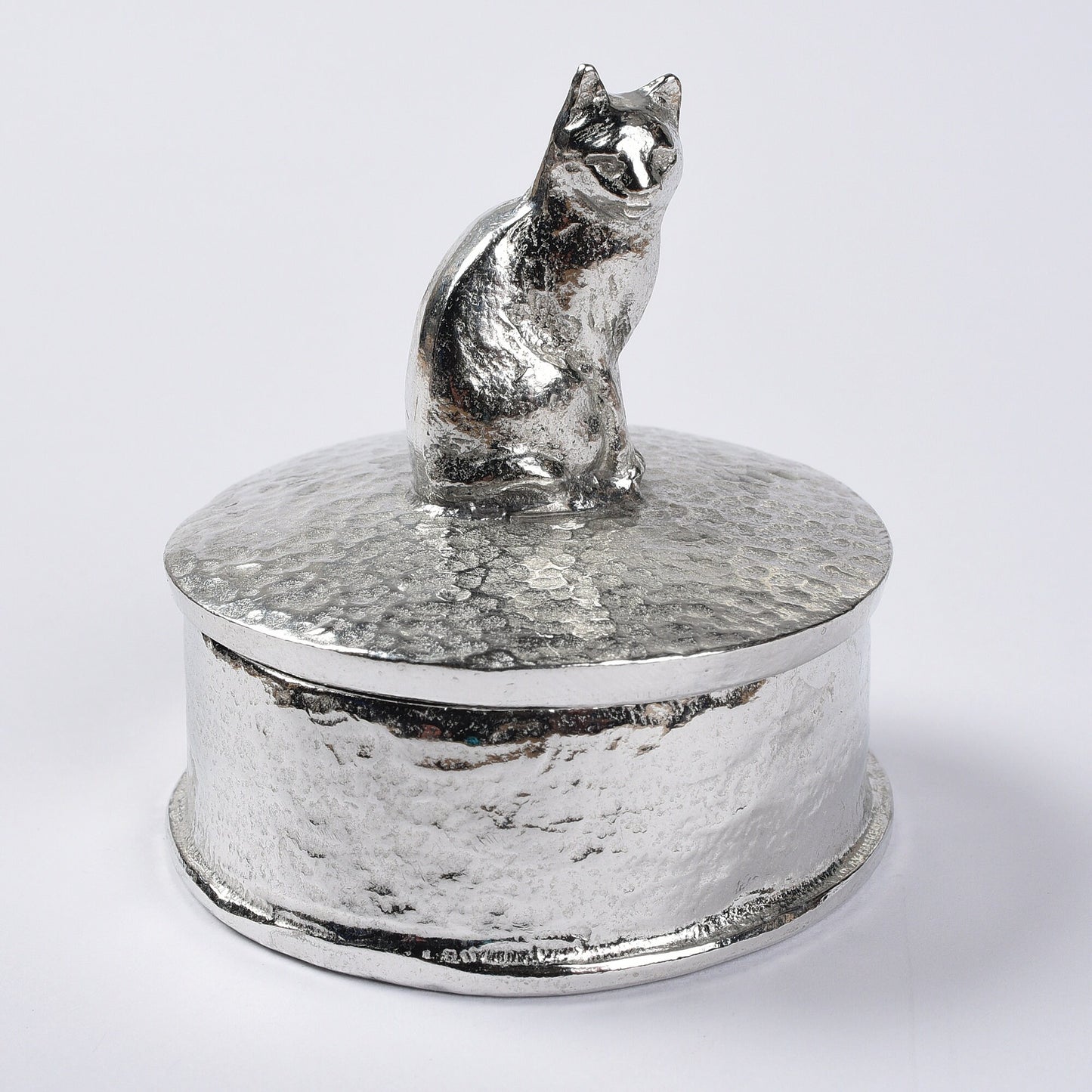 Cat pewter personalised trinket box. Our round cat keepsake box features a cat sculpture as a handle. The underside of the lid can be engraved with your personalised message. Cat gifts, personalised gifts for cat lovers. Country gifts, made in Britain.