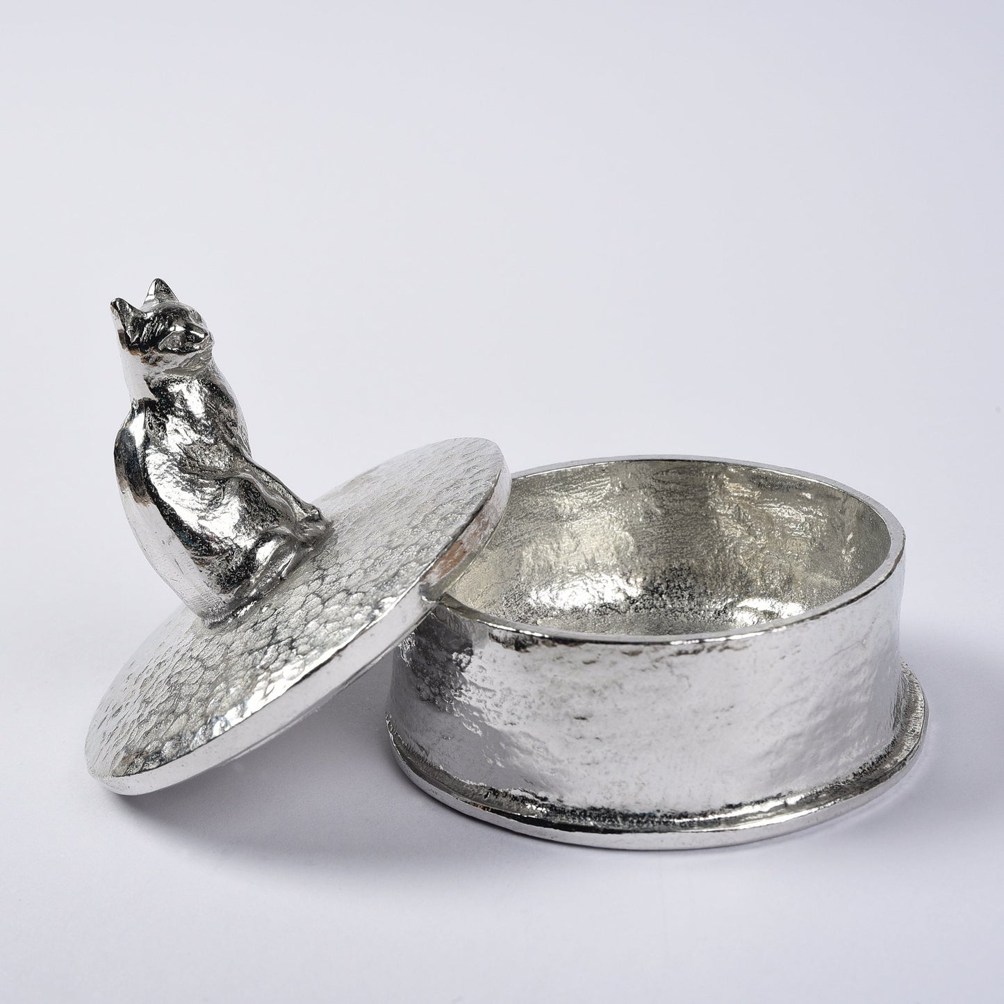 Cat pewter personalised trinket box. Our round cat keepsake box features a cat sculpture as a handle. The underside of the lid can be engraved with your personalised message. Cat gifts, personalised gifts for cat lovers. Country gifts, made in Britain.