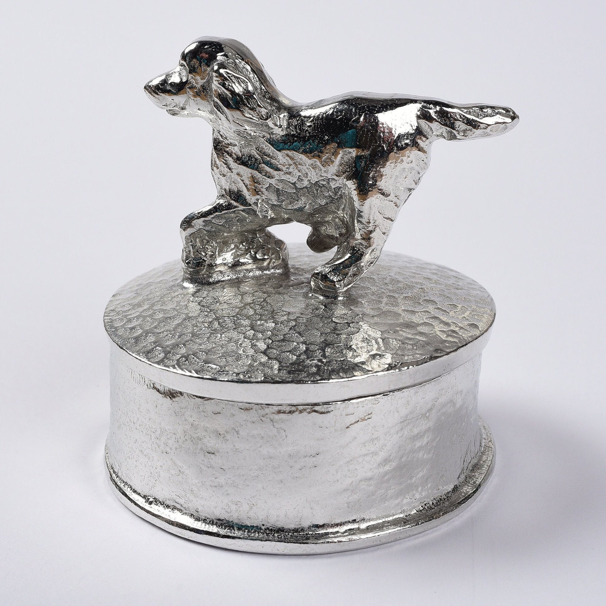 Spaniel pewter personalised trinket box. Our round spaniel keepsake box features a running springer spaniel sculpture as a handle. The underside of the lid can be engraved with your personalised message. Dog gifts, personalised gifts for dog lovers.