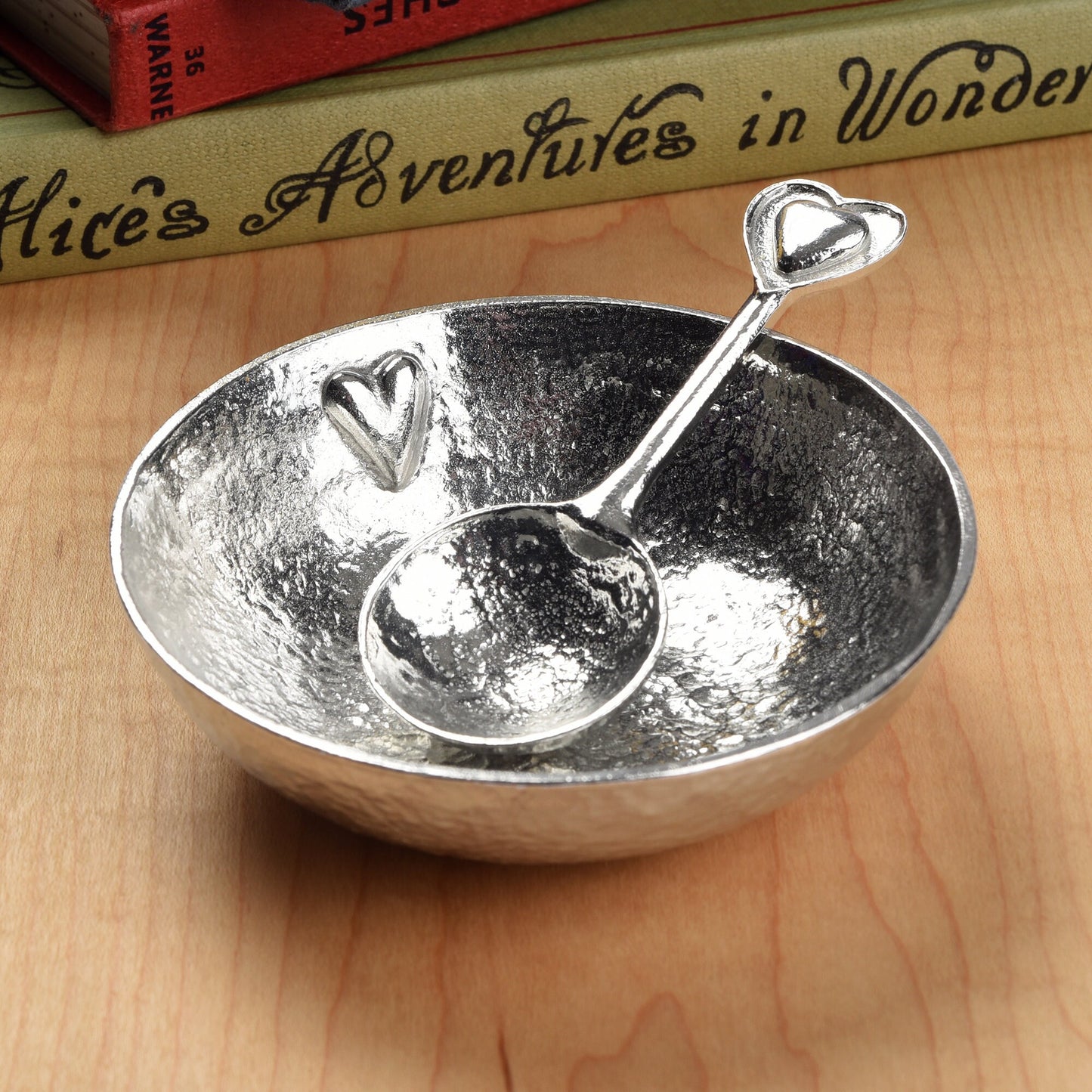 A 9cm diameter textured, circular pewter bowl, with a beautiful, yet subtle heart on the inside of the dish, comes with an accompanying heart love spoon. A perfect 10th (Tin) ten year wedding anniversary gift (Our pewter is 95% tin).