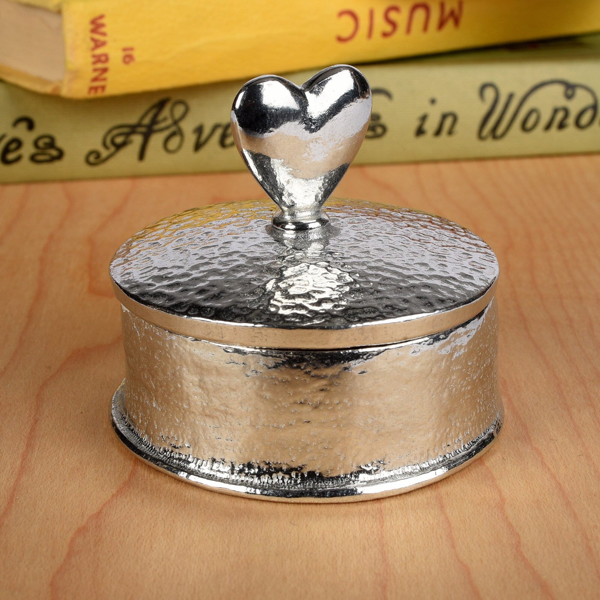 Heart 10th wedding anniversary pewter personalised trinket box gift. Our round anniversary keepsake box features a heart sculpture as a handle. The underside of the lid can be engraved with your message. A perfect tin ten year  anniversary gift (Our pewter is 95% tin)