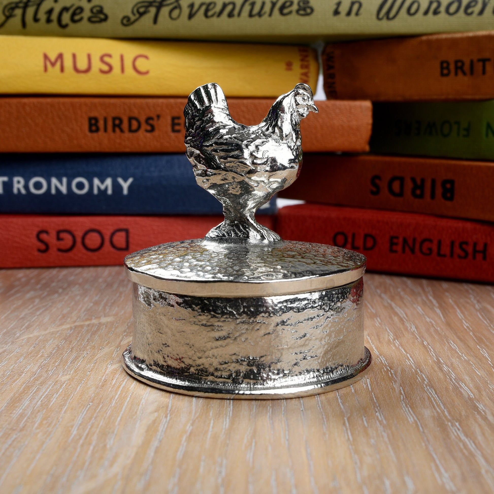 Chicken pewter personalised trinket box. Our round keepsake box has a chicken sculpture as a handle. The underside of the lid can be engraved with your personalised message. A perfect 10th (Tin) ten year wedding anniversary gift (Our pewter is 95% tin)