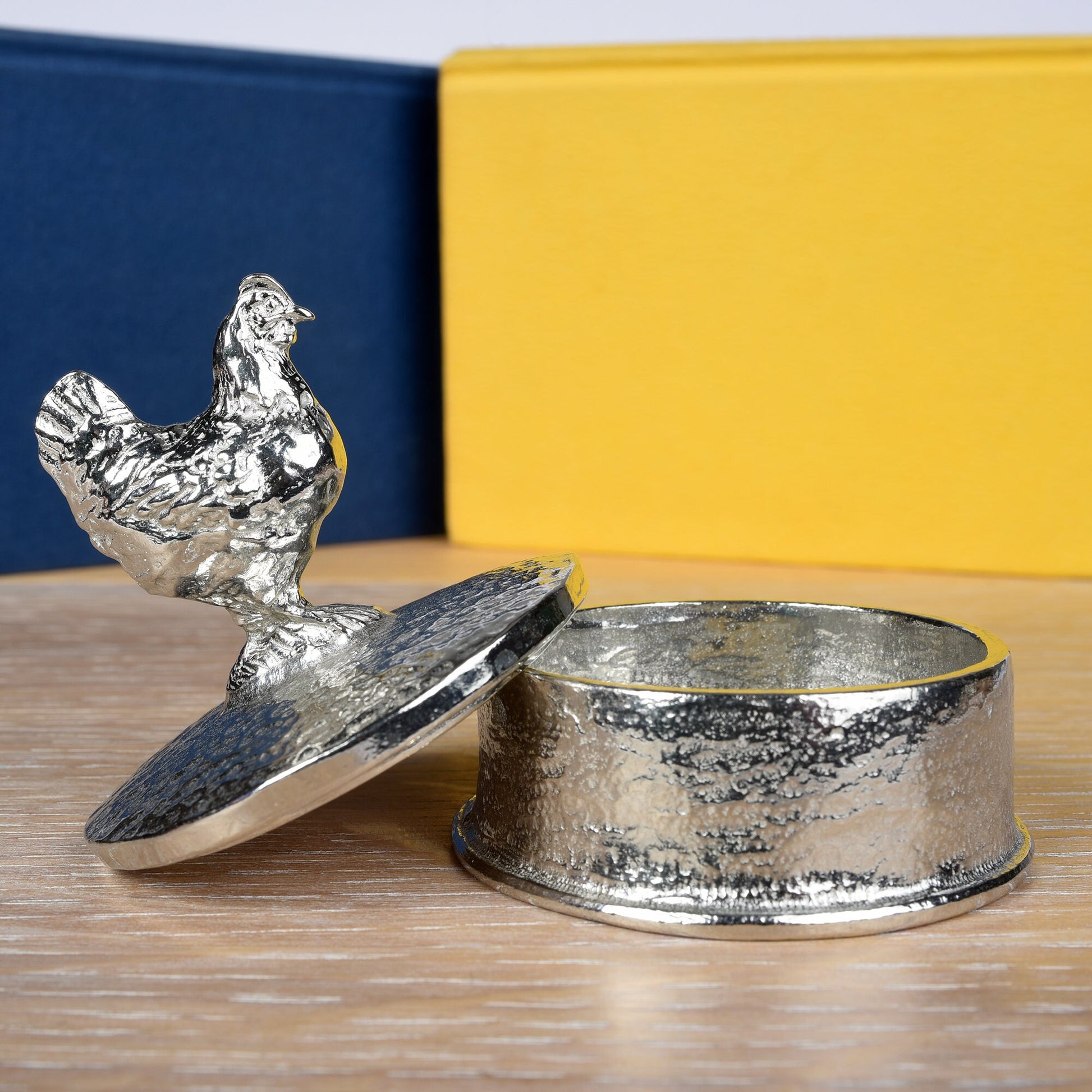 Chicken pewter personalised trinket box. Our round keepsake box has a chicken sculpture as a handle. The underside of the lid can be engraved with your personalised message. A perfect 10th (Tin) ten year wedding anniversary gift (Our pewter is 95% tin)