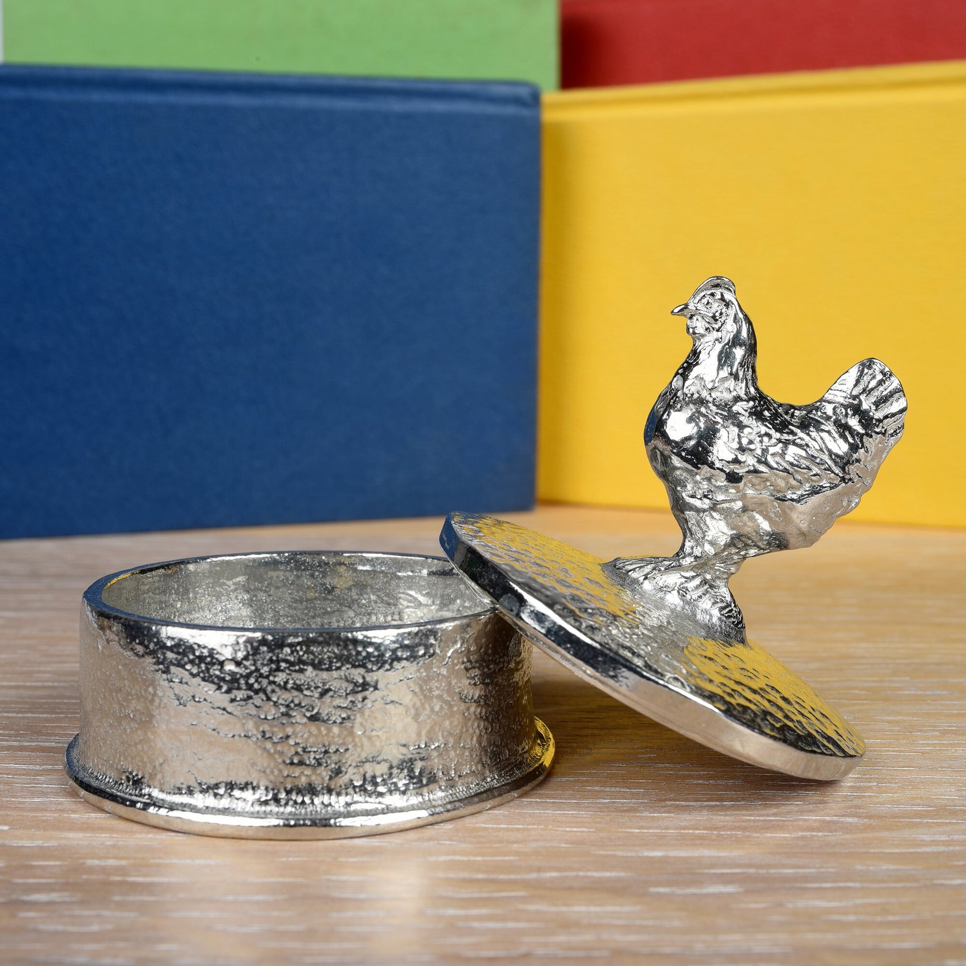 Chicken pewter personalised trinket box. Our round keepsake box has a chicken sculpture as a handle. The underside of the lid can be engraved with your personalised message. A perfect 10th (Tin) ten year wedding anniversary gift (Our pewter is 95% tin)