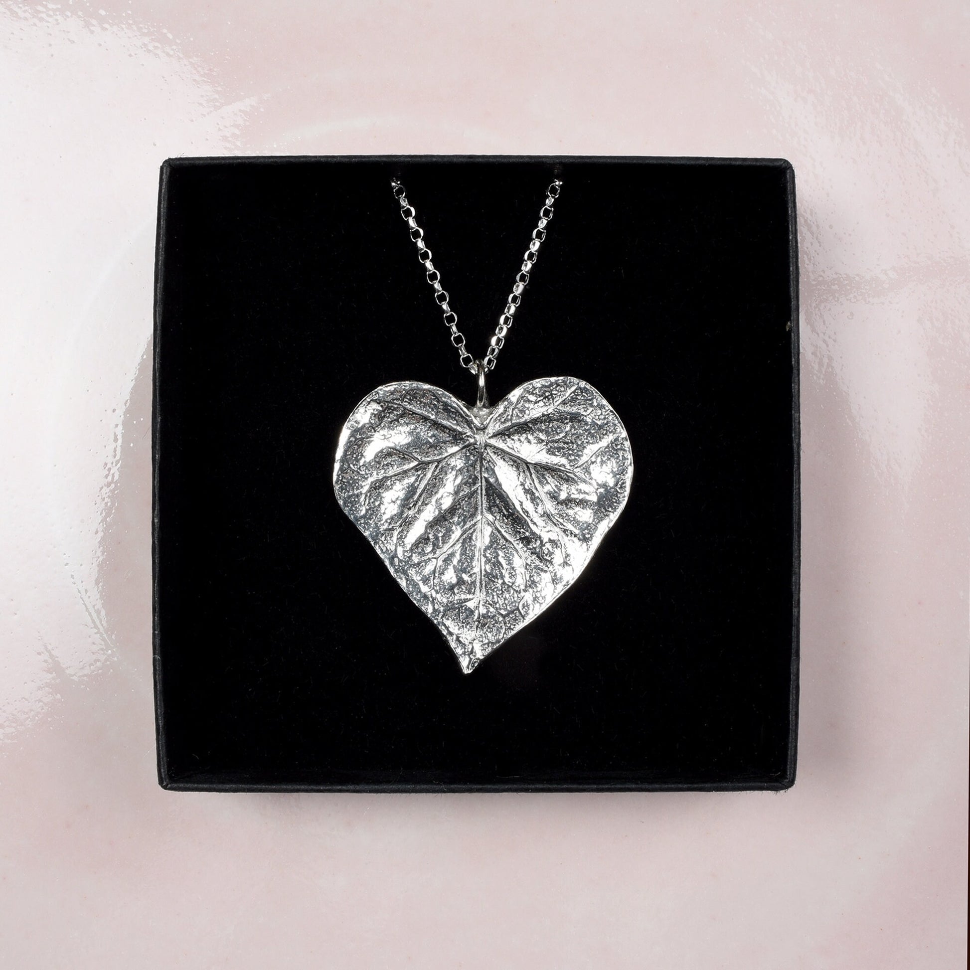 A detailed pewter heart shaped leaf necklace on an 18" Sterling silver chain. Gifts for nature lovers, heart leaf jewellery. Great jewellery gifts for her. The perfect 10th tin 10 year wedding anniversary gift (Our pewter is 95% tin). Made in Britain with love.