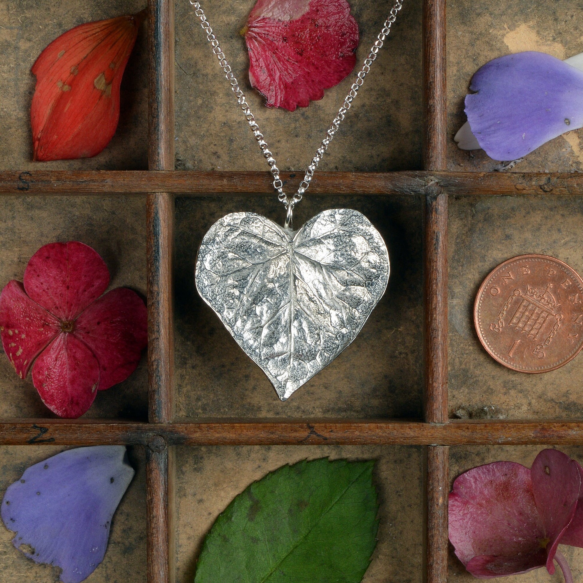 A detailed pewter heart shaped leaf necklace on an 18" Sterling silver chain. Gifts for nature lovers, heart leaf jewellery. Great jewellery gifts for her. The perfect 10th tin 10 year wedding anniversary gift (Our pewter is 95% tin). Made in Britain with love.