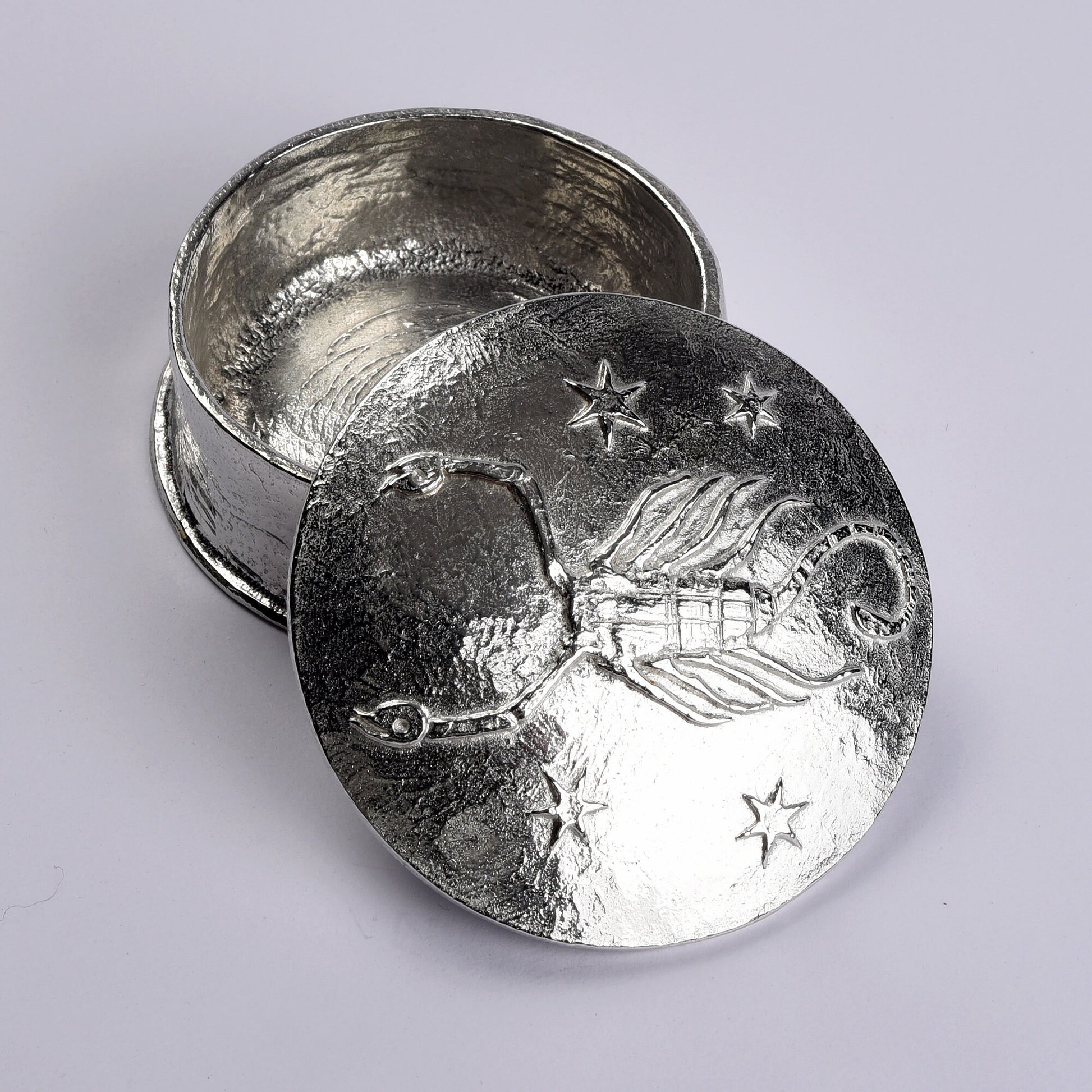 A beautifully detailed and textured Scorpio scorpion zodiac sign guards precious treasure on this personalised pewter trinket box. Pensonalised birthday gifts for Scorpios. The underside of the lid can be engraved with your personalised message.