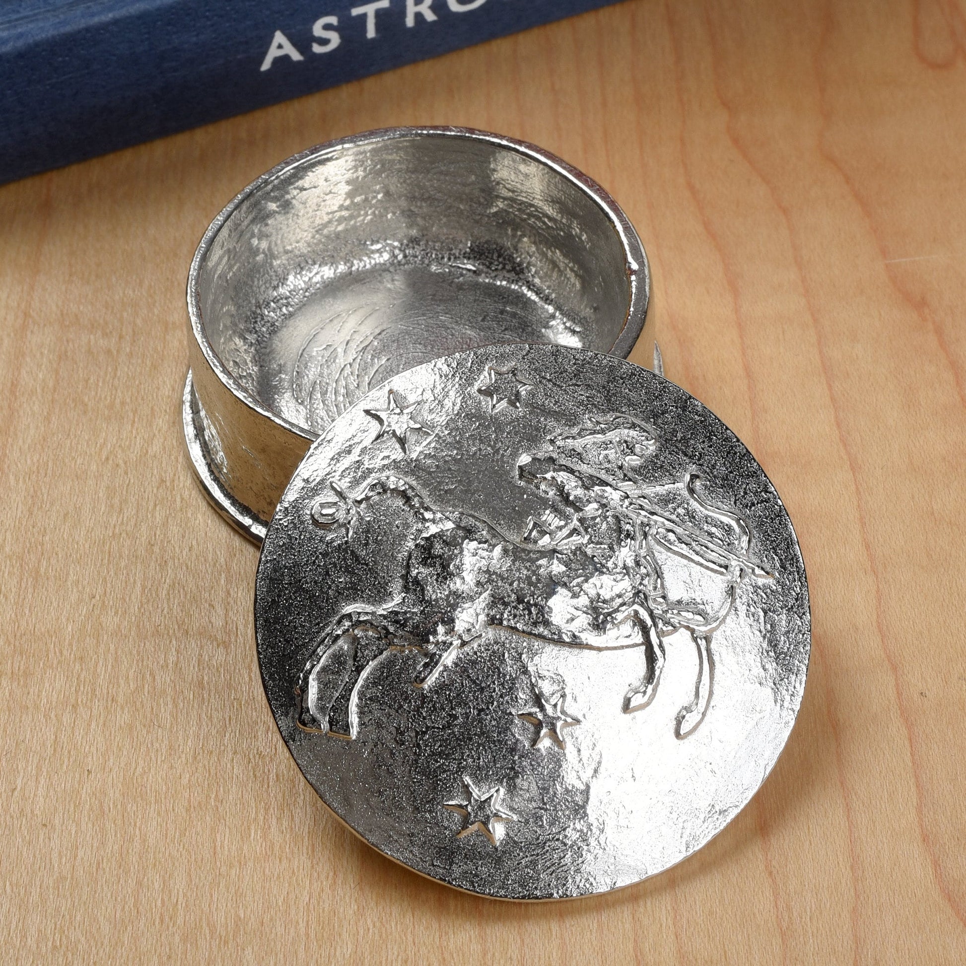 A beautifully detailed and textured Sagittarius zodiac sign guards precious treasure on this lovely personalised pewter trinket box. The underside of the lid can be engraved with your personalised message. Birthday gifts for Sagittarians