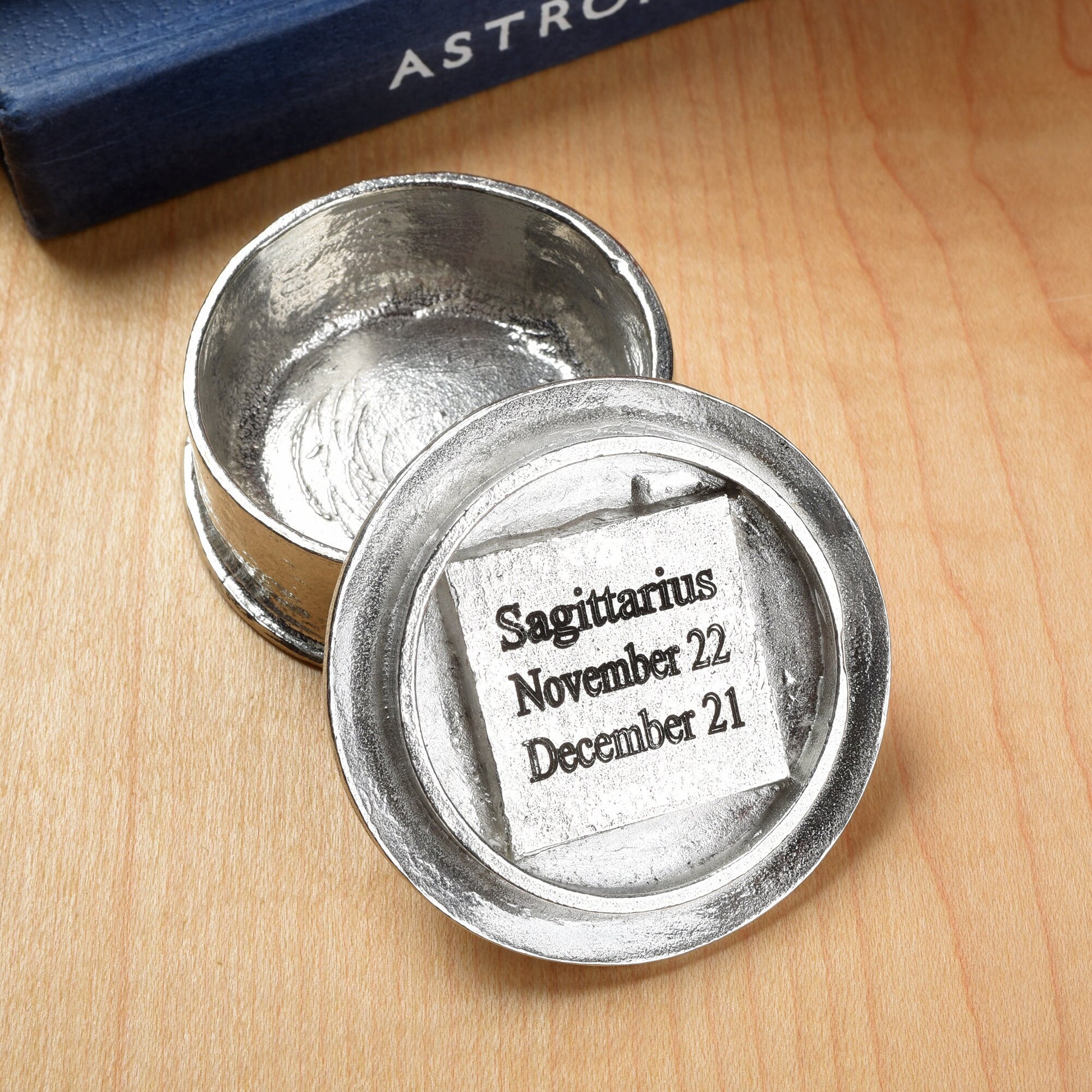 A beautifully detailed and textured Sagittarius zodiac sign guards precious treasure on this lovely personalised pewter trinket box. The underside of the lid can be engraved with your personalised message. Birthday gifts for Sagittarians