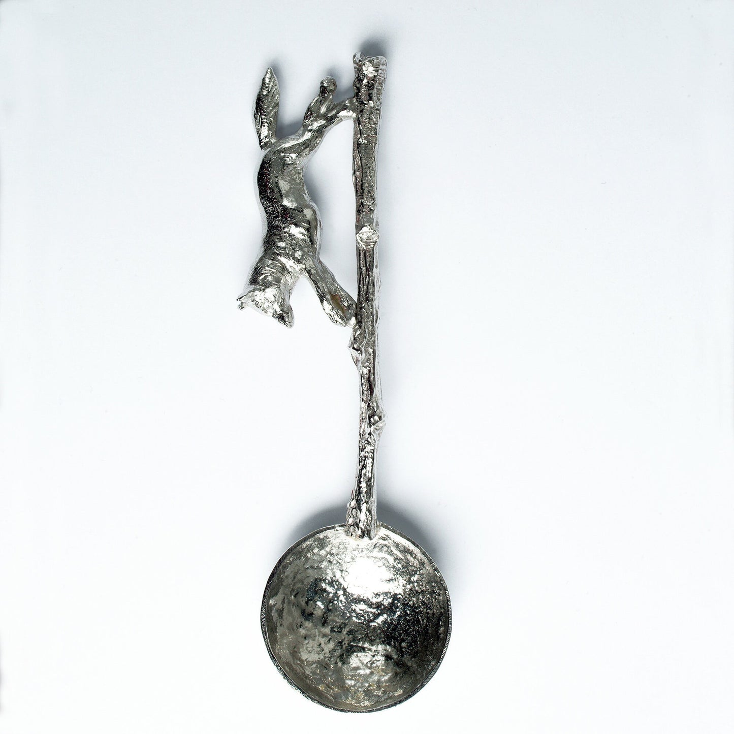 A small spoon pewter sugar spoon with a detailed fox running along a twig handle. Unusual, useful and tactile gifts for nature lovers, fox gifts handmade in the UK useful countryside gifts