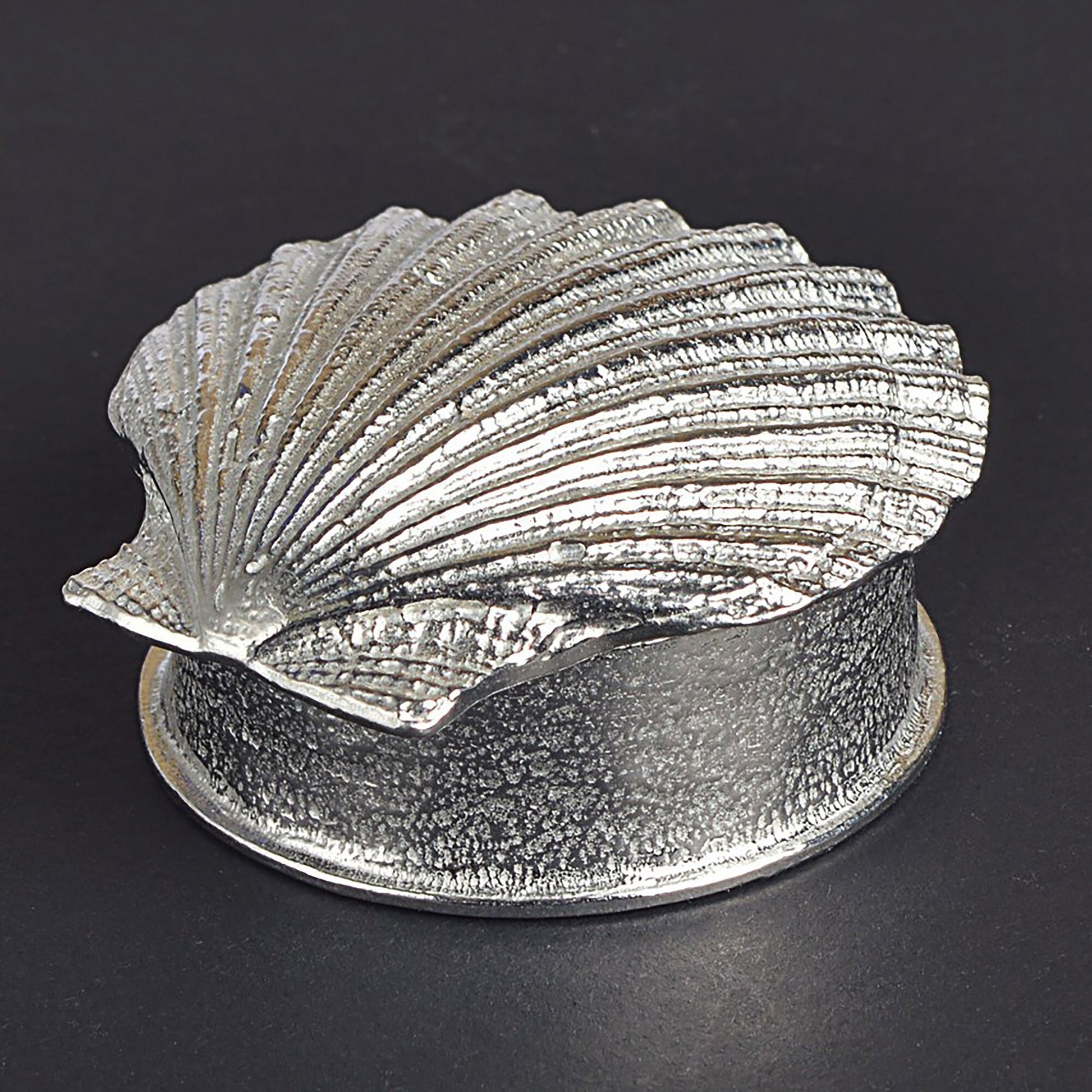 A round  pewter trinket box with a scallop shell lid. Nautical gifts for lovers of the seaside and sea life. 