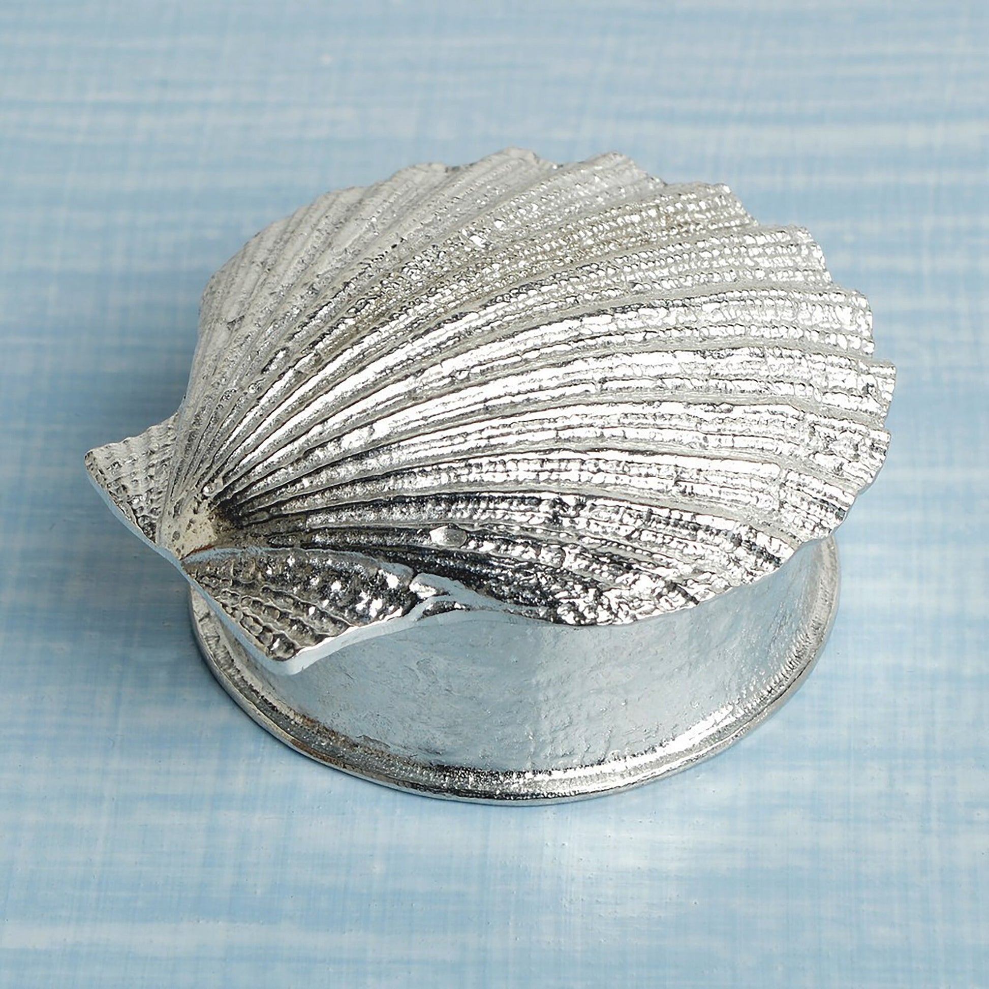 A round  pewter trinket box with a scallop shell lid. Nautical gifts for lovers of the seaside and sea life. 