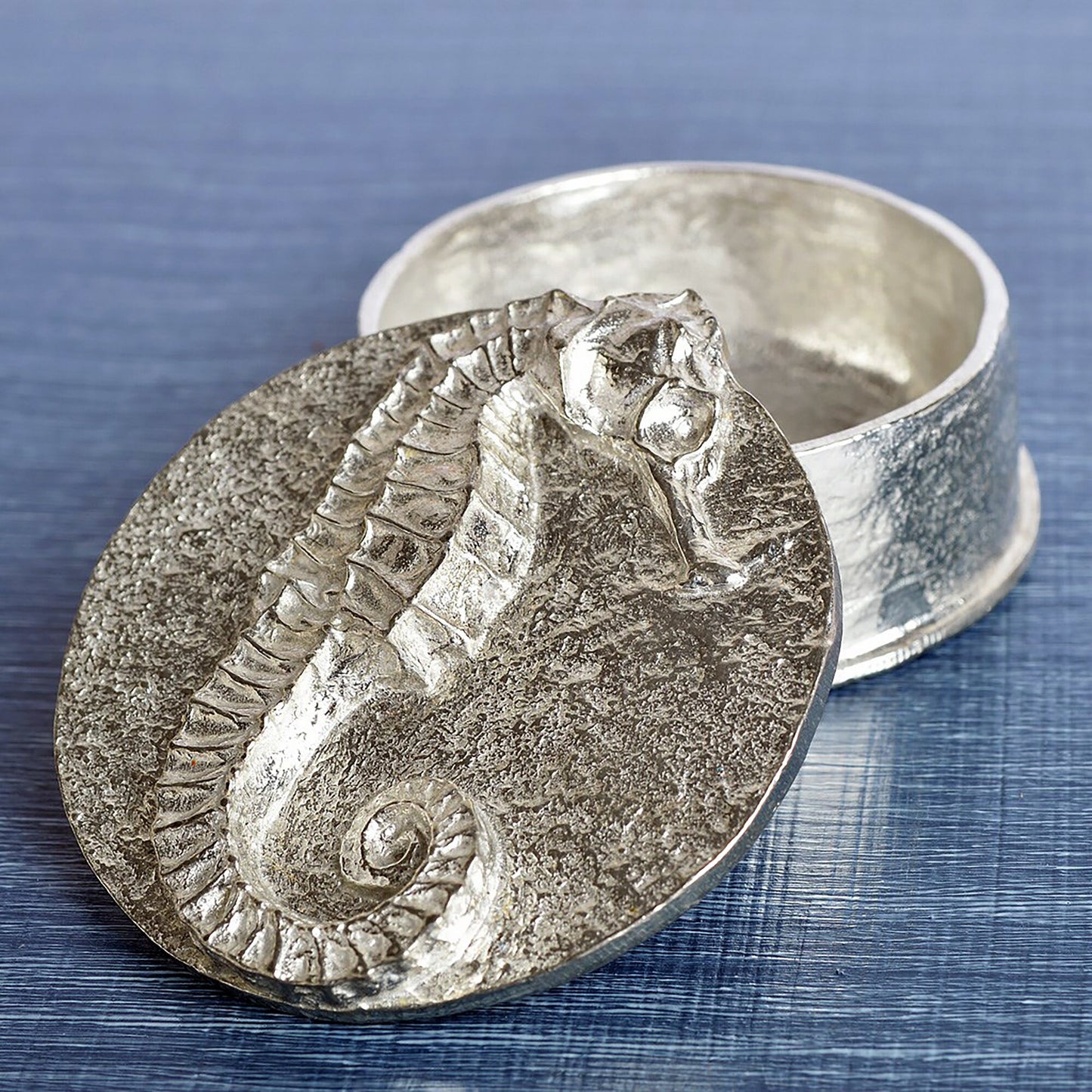 A round  pewter trinket box with a seahorse on the lid. Nautical gifts for lovers of the seaside and sea life. Seahorse gifts, gifts for seahorse lovers.