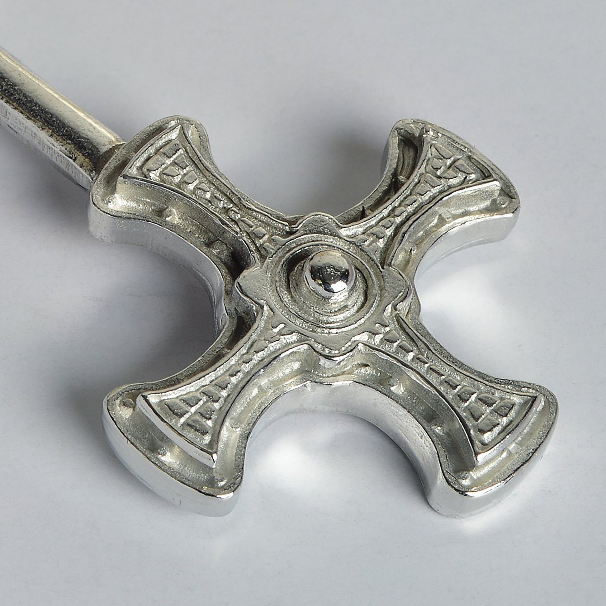 A small spoon pewter sugar spoon with Durham cathedral's St Cuthbert Cross on the end of a straight handle. Christening gifts for boys and girls