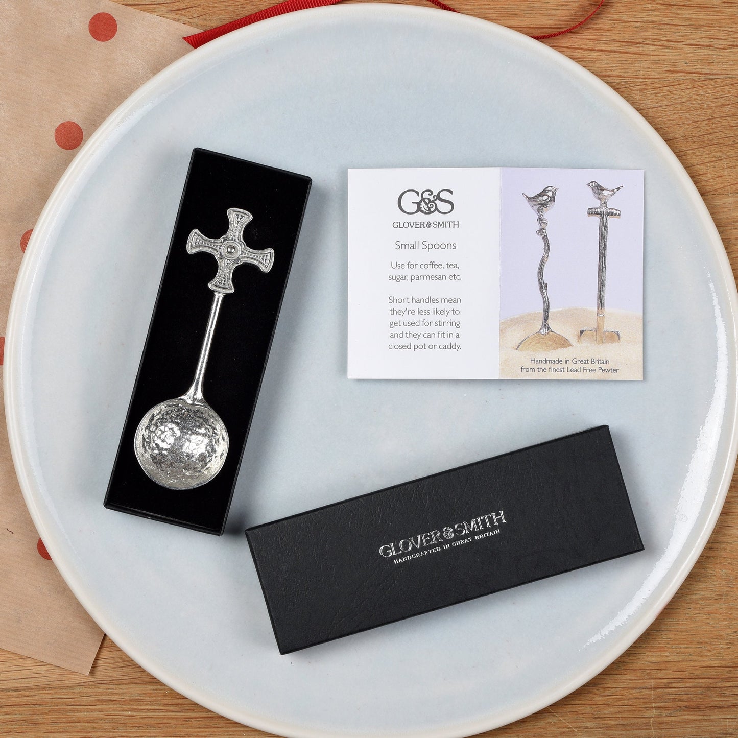 A small spoon pewter sugar spoon with Durham cathedral's St Cuthbert Cross on the end of a straight handle. Christening gifts for boys and girls