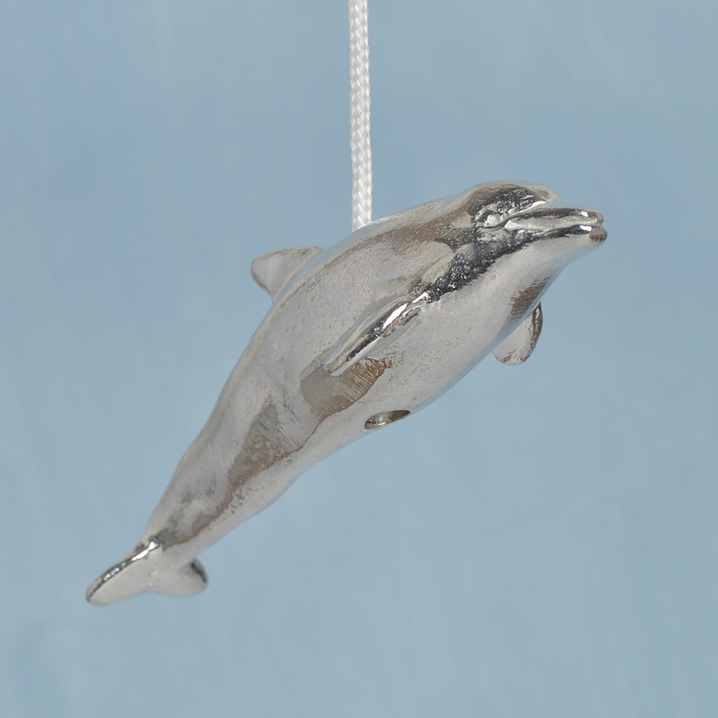 Dolphin bathroom light pull or cord pull. A tactile and decorative pewter dolphin hangs at the bottom of the bathroom light switch cord. ideal little housewarming gifts. Dolphin gifts.