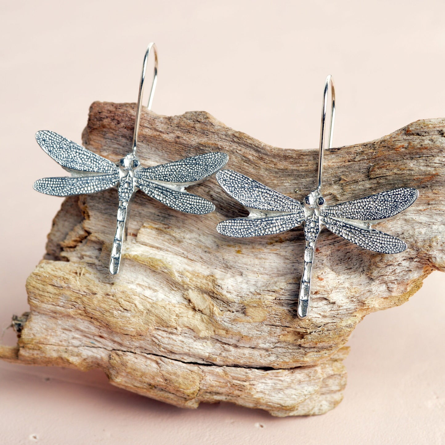 Dragonfly drop earrings, pewter dragonflies on Sterling silver ear hooks. Pewter and silver dragonfly jewellery gifts, handmade in the UK by Glover and Smith