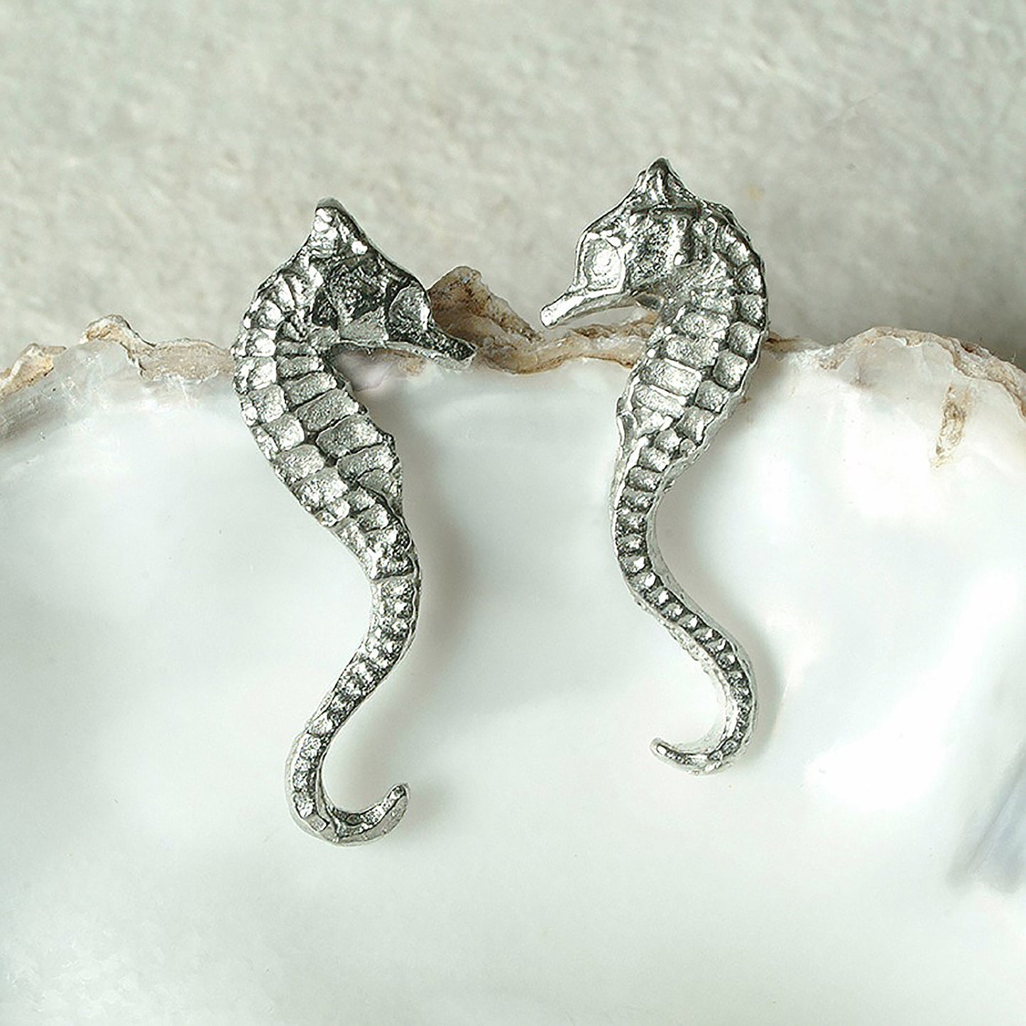 Seahorse stud earrings, pewter seahorses on Sterling silver stud posts. Pewter and silver seahorse jewellery gifts, handmade in the UK by Glover and Smith