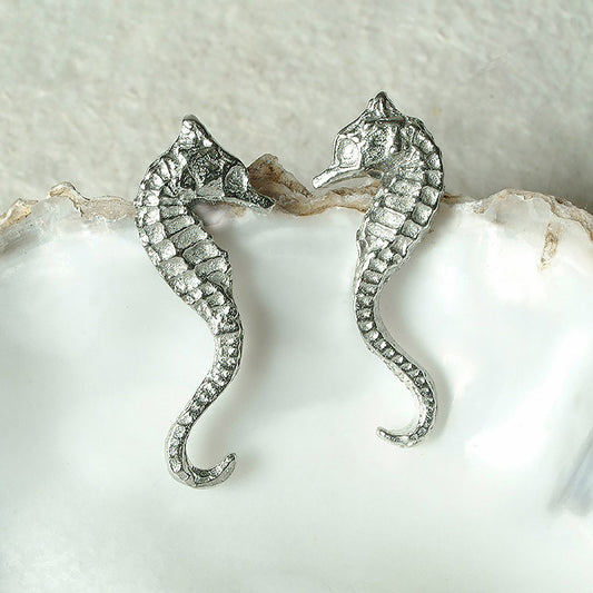 Seahorse stud earrings, pewter seahorses on Sterling silver stud posts. Pewter and silver seahorse jewellery gifts, handmade in the UK by Glover and Smith