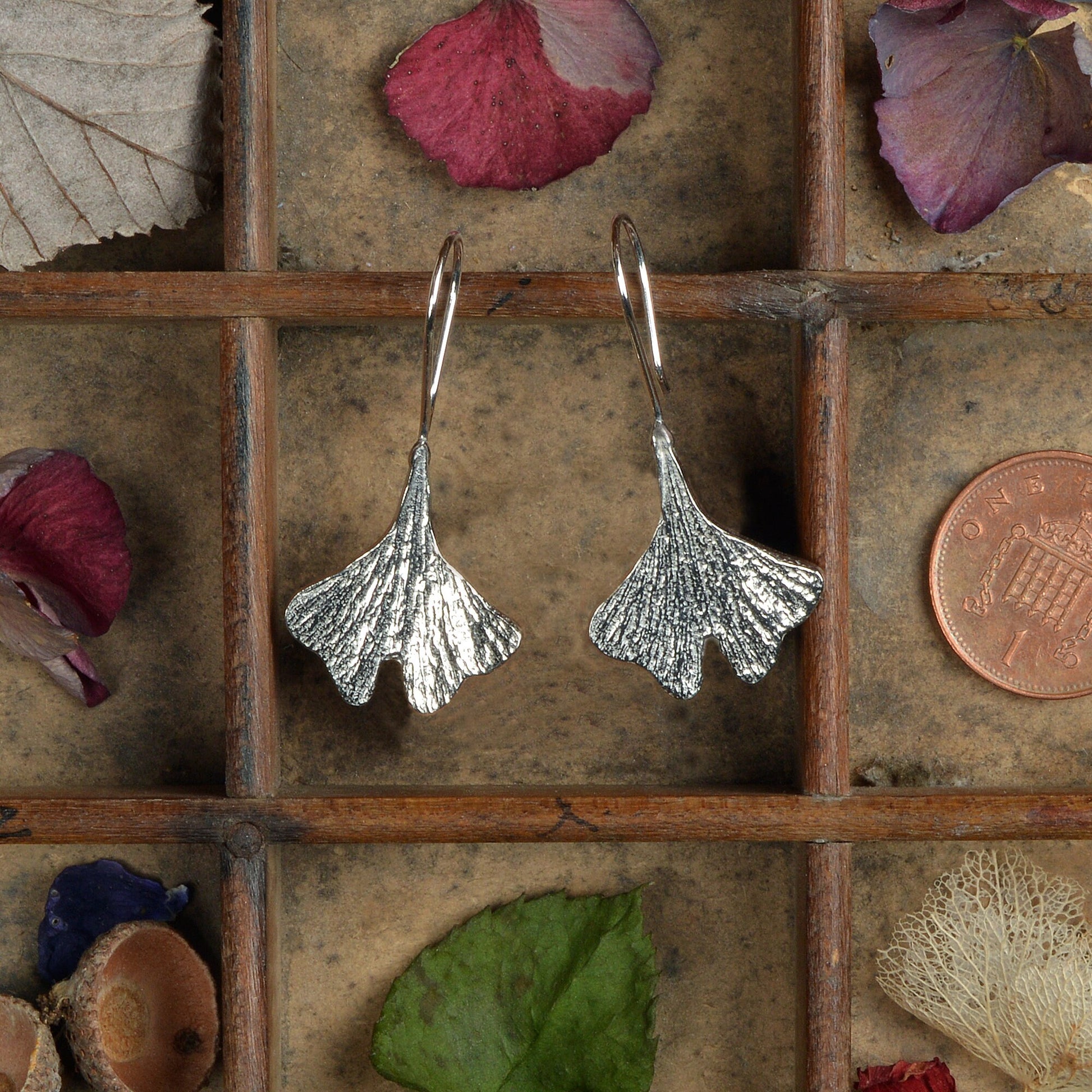 Ginkgo leaf drop earrings, pewter ginkgo leaves on Sterling silver ear hooks. Pewter and silver ginkgo leaf jewellery gifts, handmade in the UK by Glover and Smith