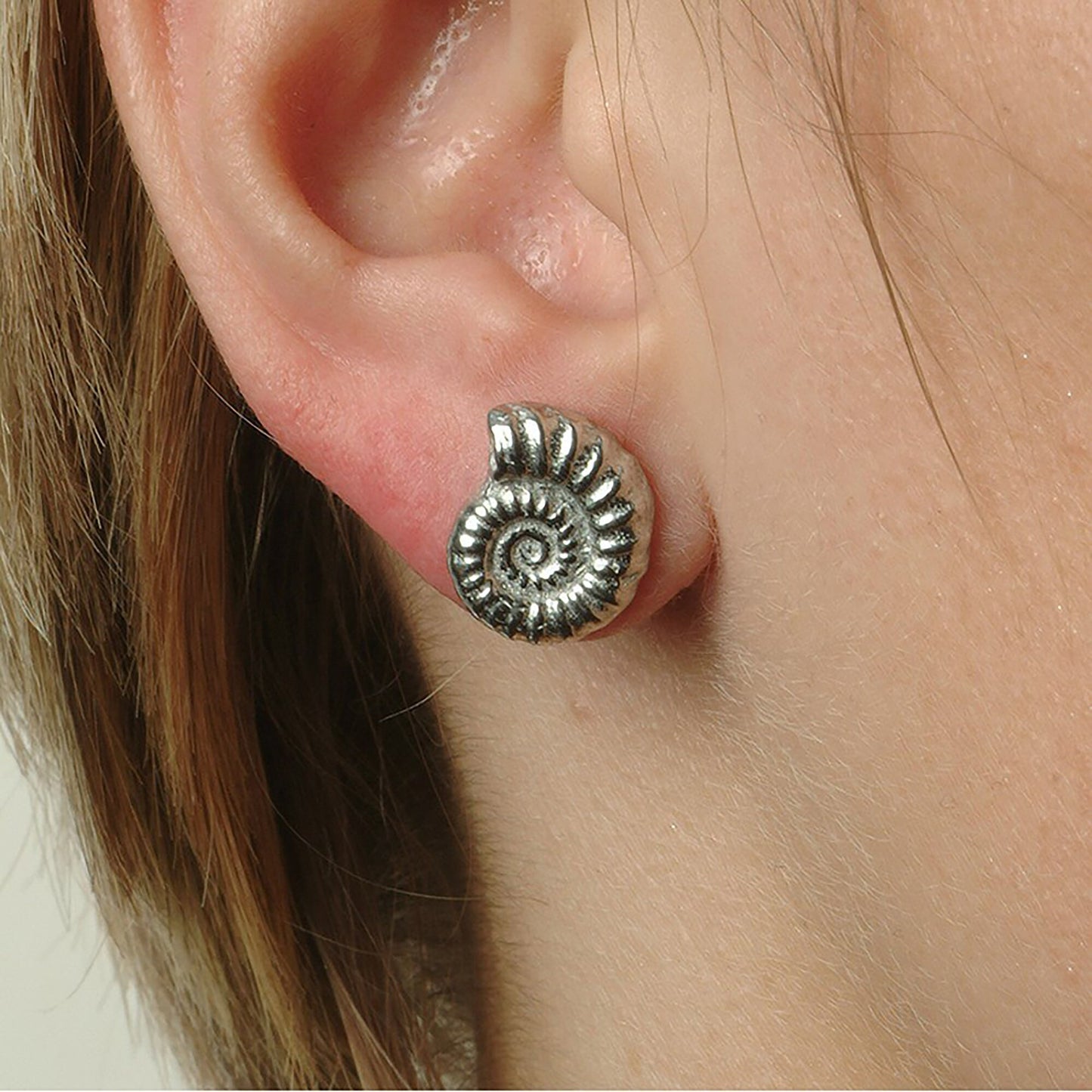 Ammonite stud earrings, pewter ammonite fossils on Sterling silver stud posts. Pewter and silver ammonite jewellery gifts, handmade in the UK by Glover and Smith