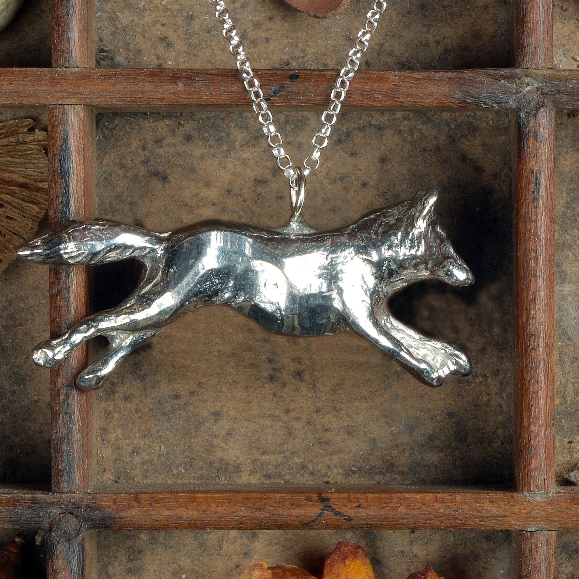 A detailed pewter running fox necklace on an 18" Sterling silver chain. Great jewellery gifts for her, fox gifts for fox lovers. Hunting gifts, country gifts. The perfect 10th tin 10 year wedding anniversary gift (Our pewter is 95% tin). Made in Britain with love. 