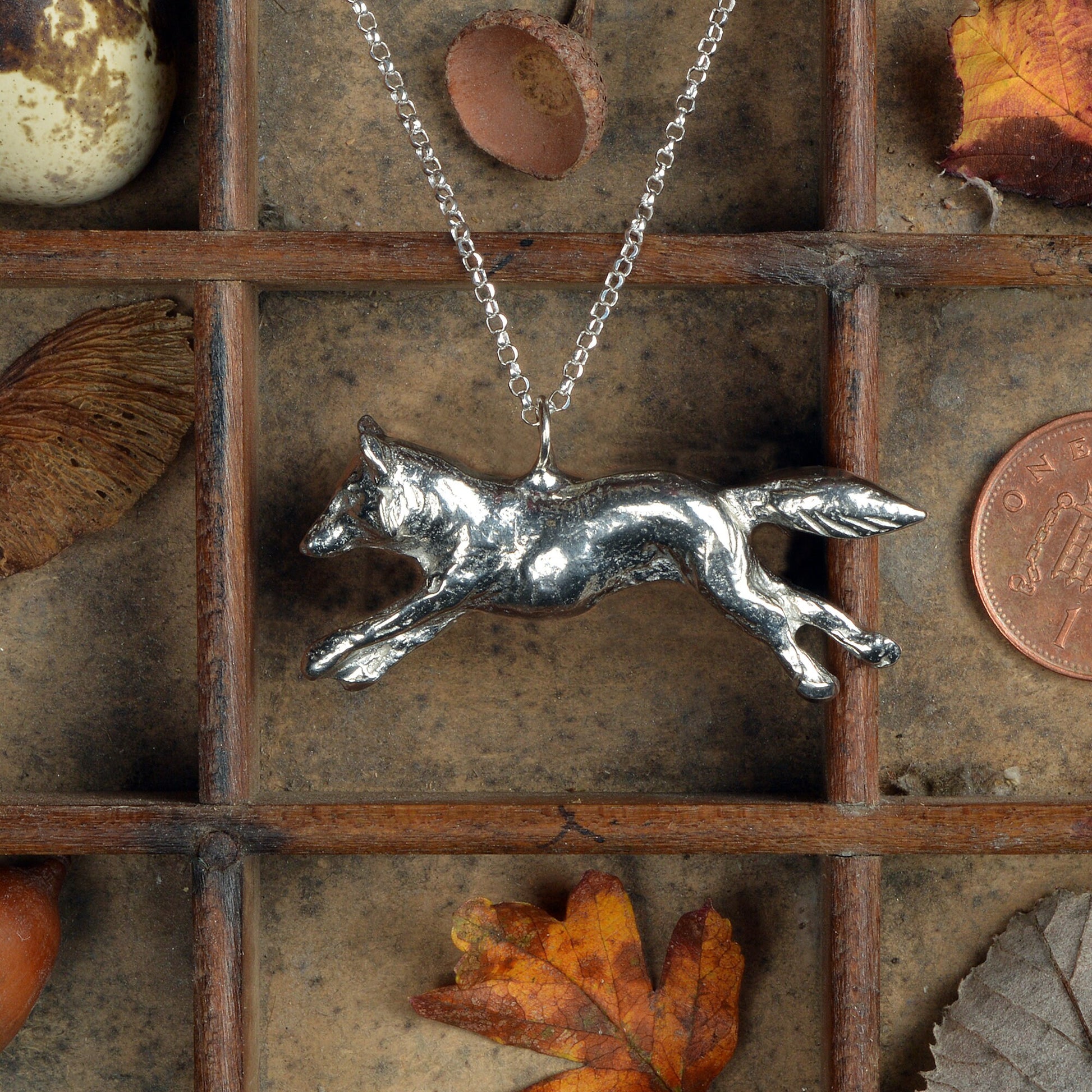 A detailed pewter running fox necklace on an 18" Sterling silver chain. Great jewellery gifts for her, fox gifts for fox lovers. Hunting gifts, country gifts. The perfect 10th tin 10 year wedding anniversary gift (Our pewter is 95% tin). Made in Britain with love. 