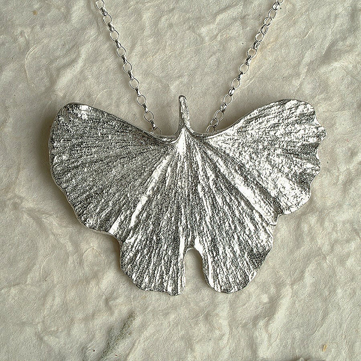 A detailed pewter ginkgo leaf necklace on an 18" Sterling silver chain. Gifts for nature lovers, ginkgo leaf jewellery. Great jewellery gifts for her. The perfect 10th tin 10 year wedding anniversary gift (Our pewter is 95% tin). Made in Britain with love.