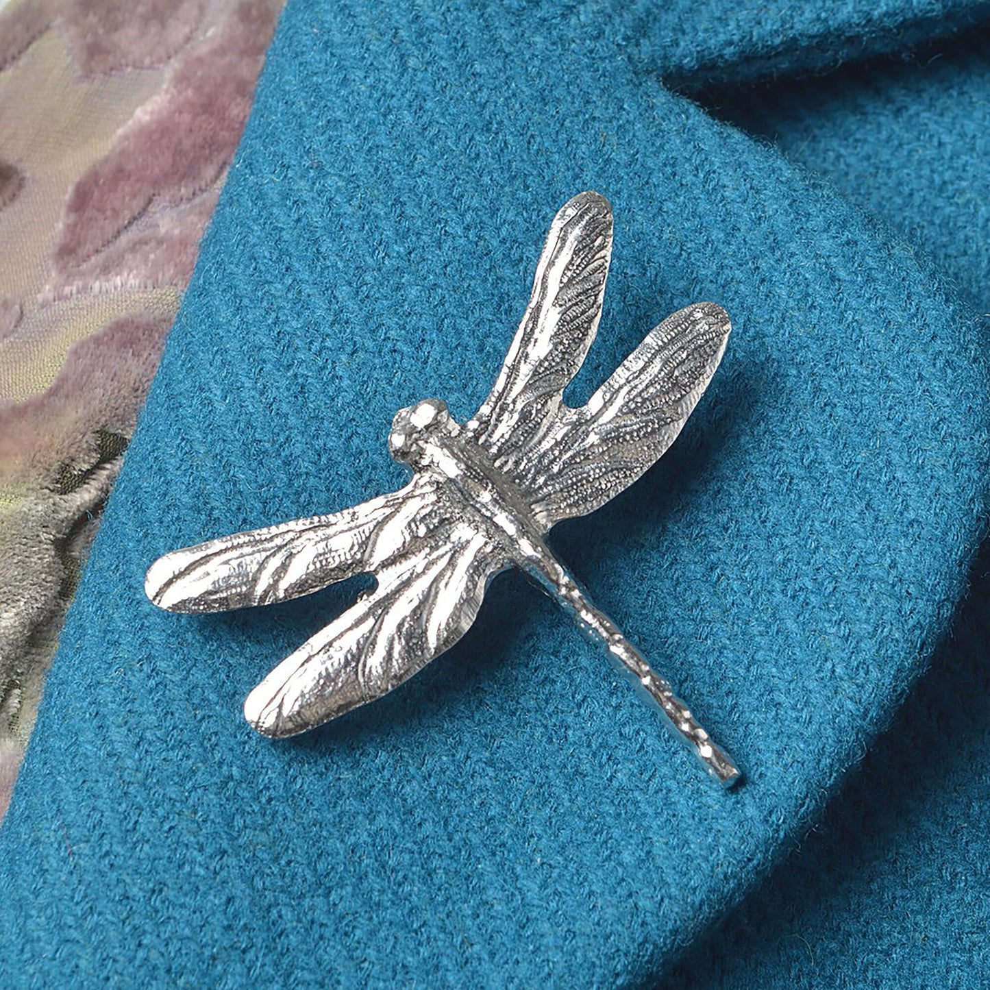 A beautifully detailed and textured dragonfly pewter brooch. Dragonfly gifts for dragonfly lovers. Ideal nature jewellery gifts for her. Each dragonfly brooch is 5.5cm (2.2 inches) tall and is attached with a metal clasp pin.