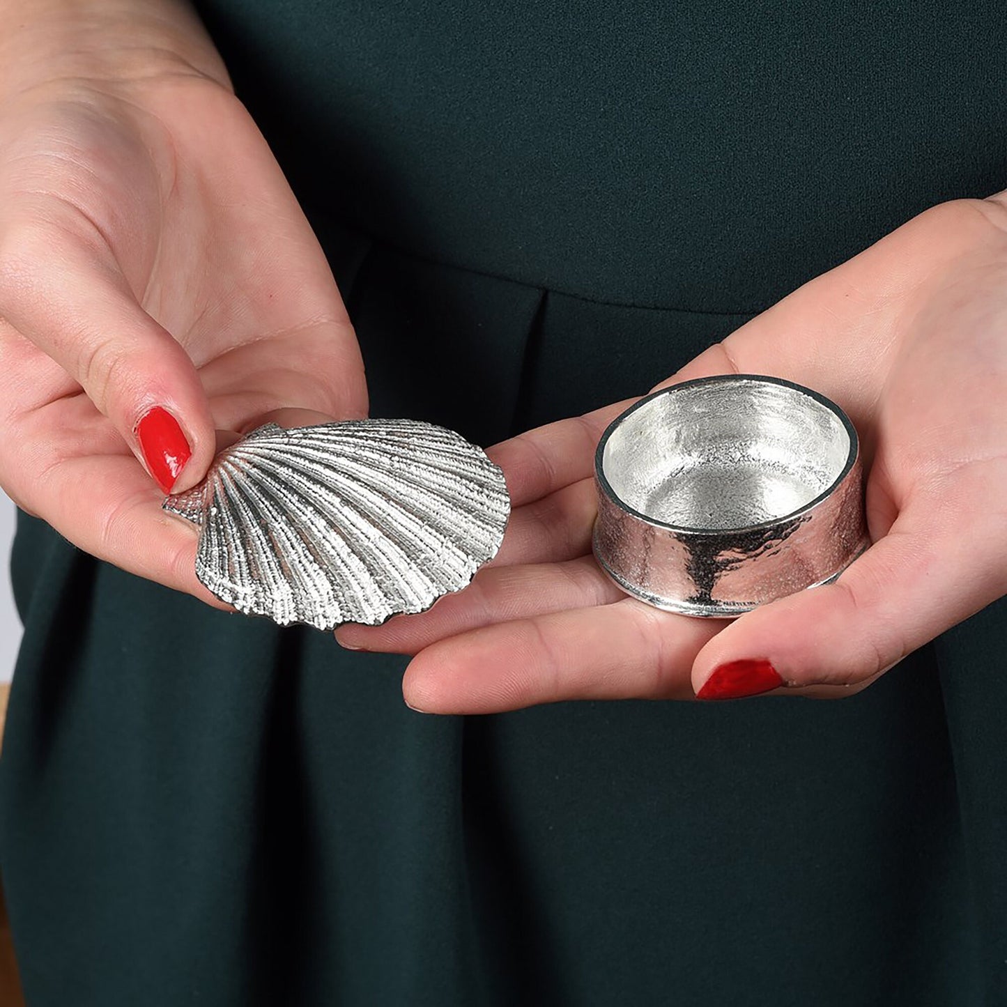 A round  pewter trinket box with a scallop shell lid. Nautical gifts for lovers of the seaside and sea life. 