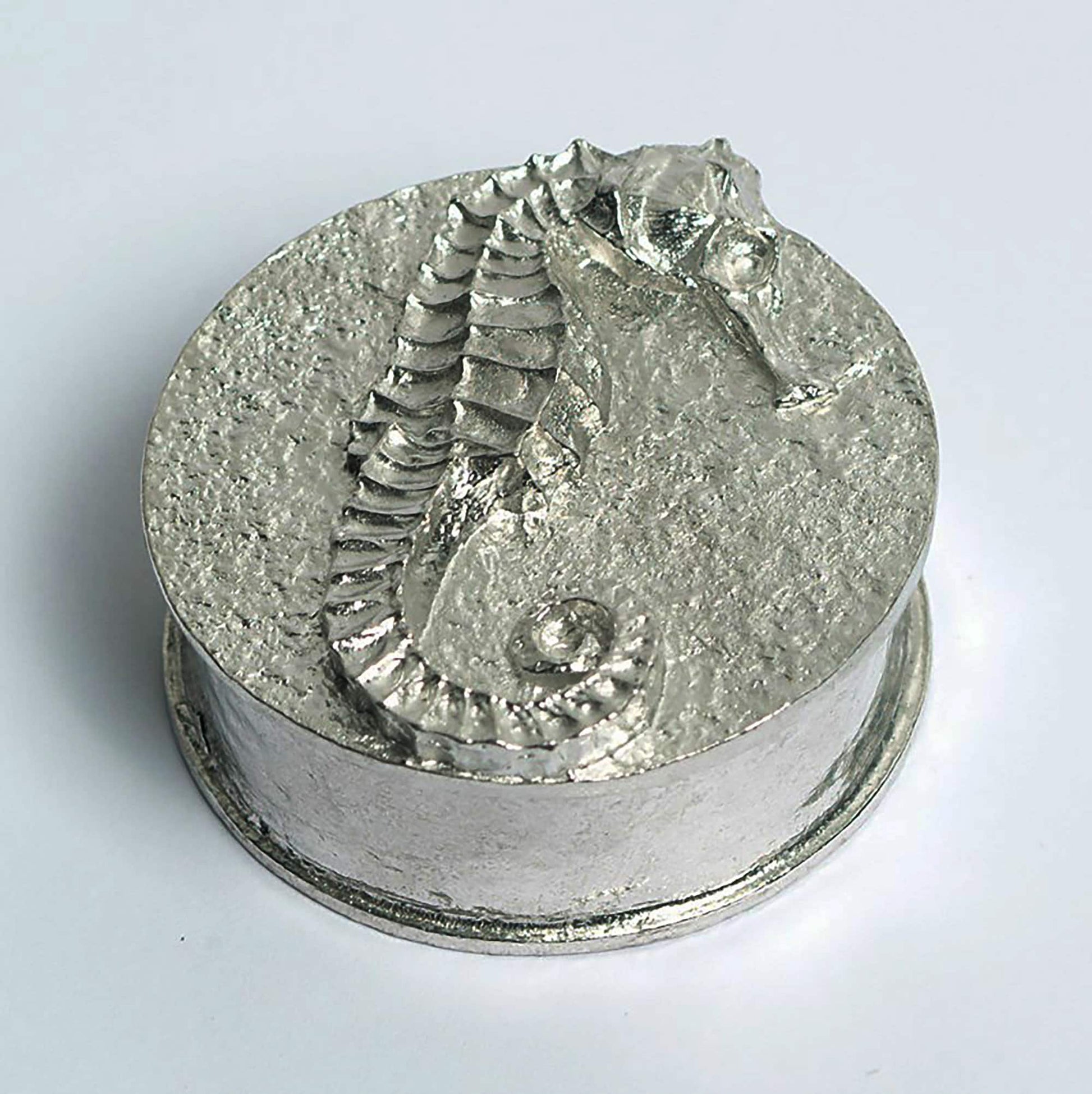 A round  pewter trinket box with a seahorse on the lid. Nautical gifts for lovers of the seaside and sea life. Seahorse gifts, gifts for seahorse lovers.