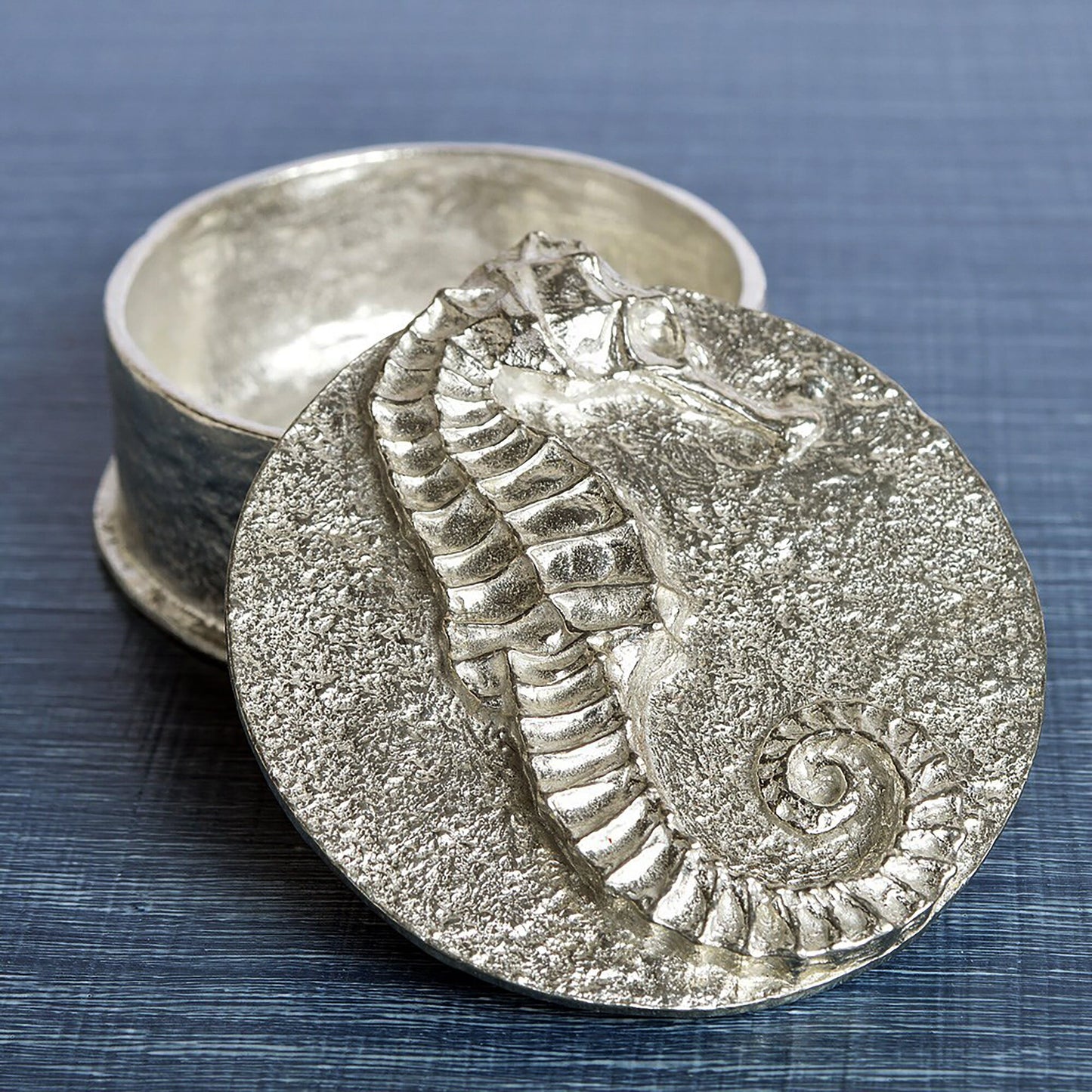 A round  pewter trinket box with a seahorse on the lid. Nautical gifts for lovers of the seaside and sea life. Seahorse gifts, gifts for seahorse lovers.