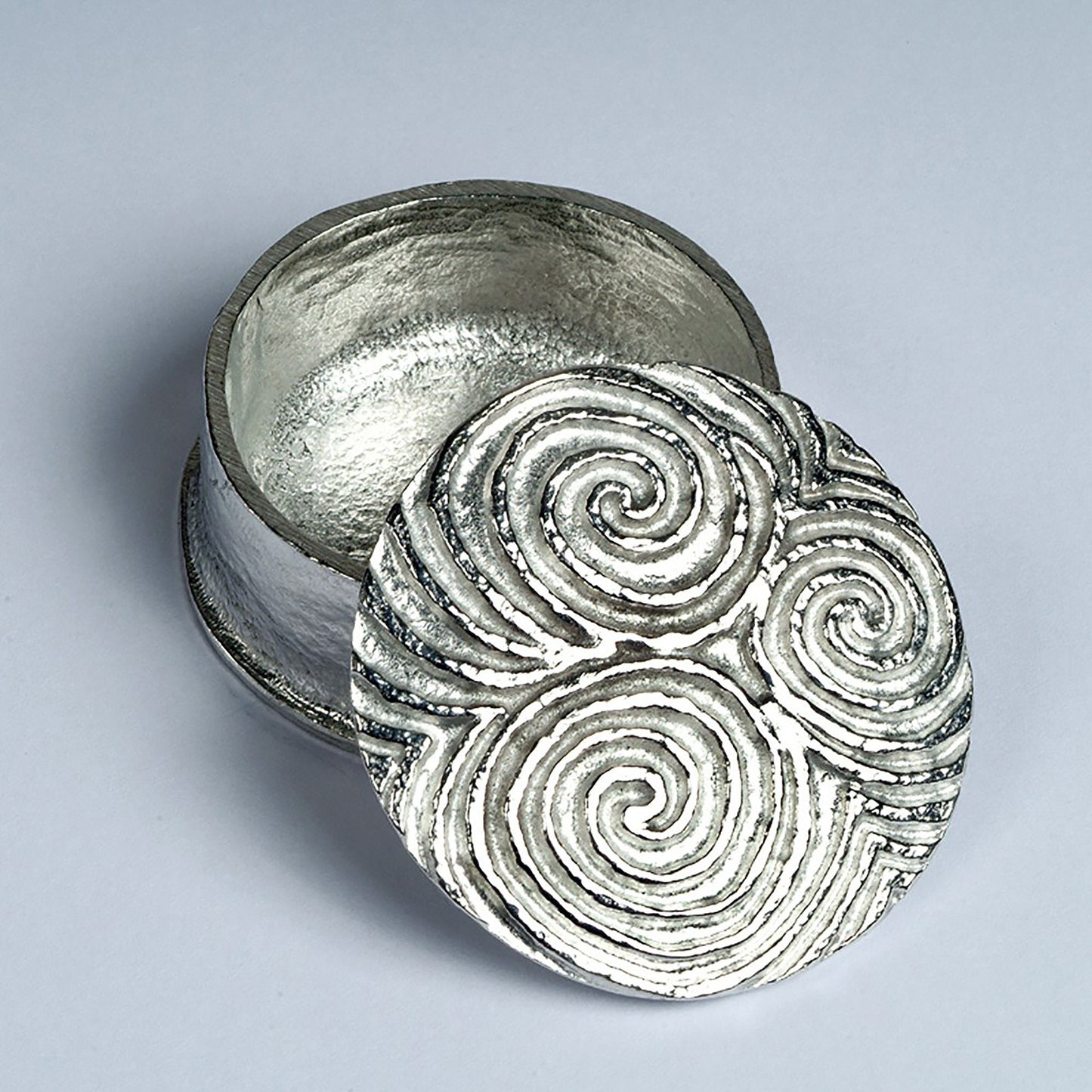 A detailed, striking and wonderfully textured Neolithic Spiral of Life Treskelion pewter trinket box. The lid features a relief of the spiral of life found in many Neolithic carvings. Celtic gifts.