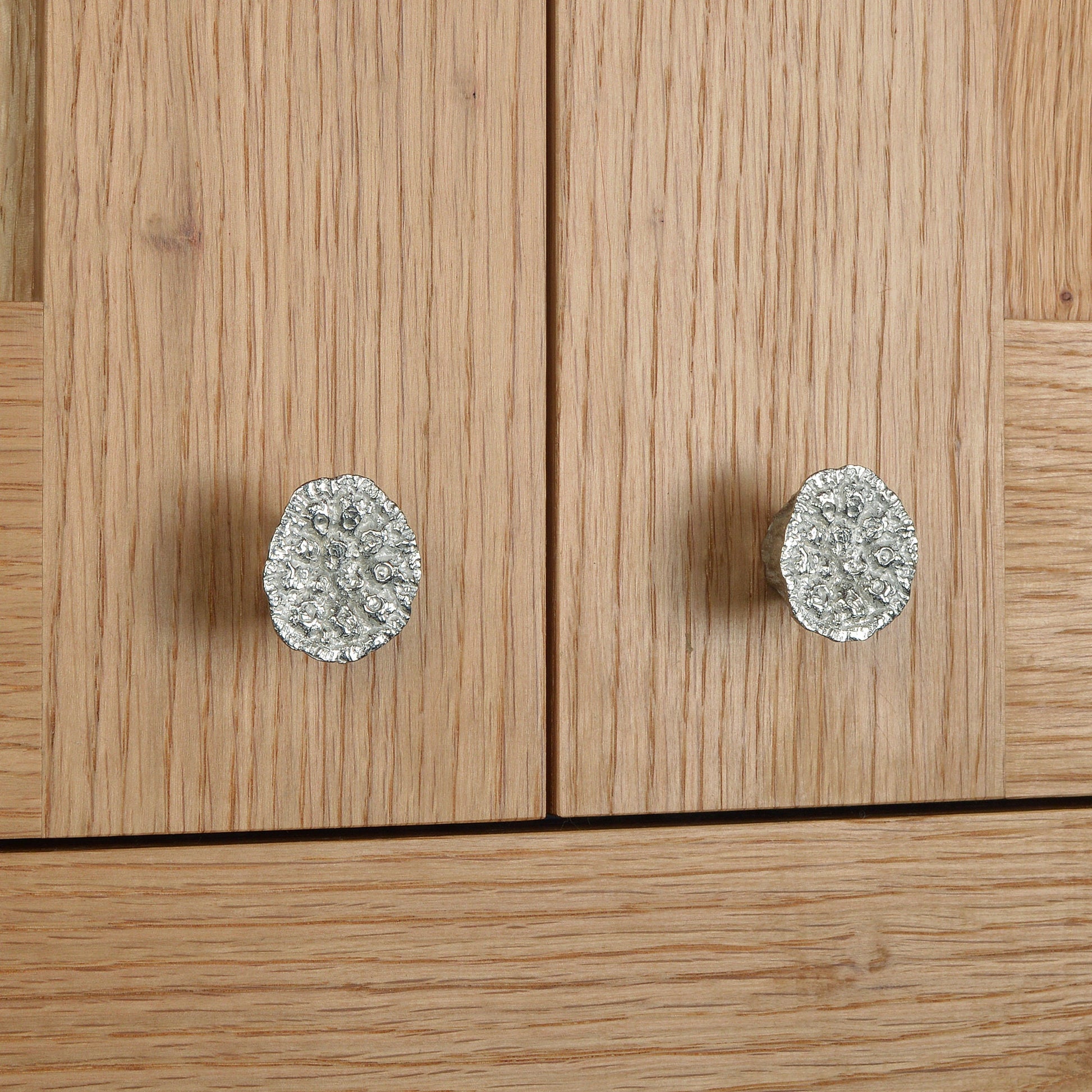 A solid pewter cabinet handle, cupboard knob, furniture handle or drawer pull in the shape of a detailed lotus seed pod. Organic, unusual handles UK handmade with finesse