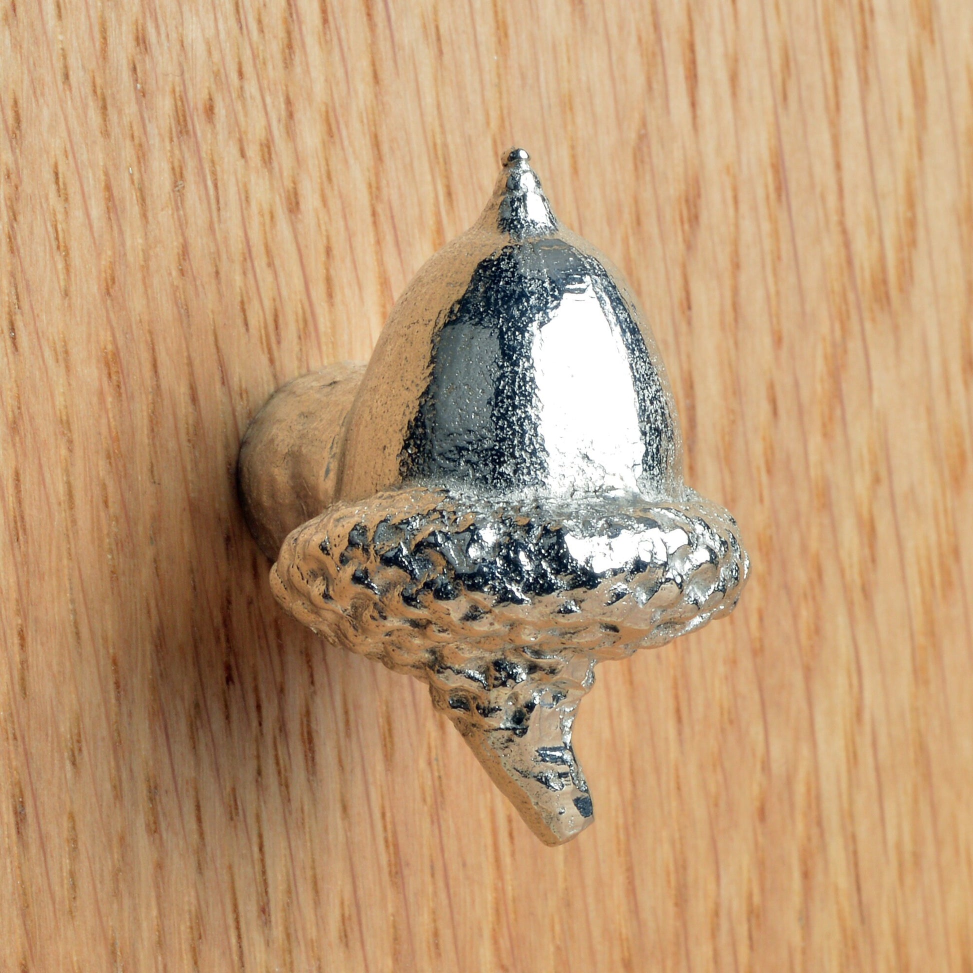 A solid pewter cabinet handle, cupboard knob, furniture handle or drawer pull in the shape of a detailed acorn. Organic, unusual handles UK handmade with finesse