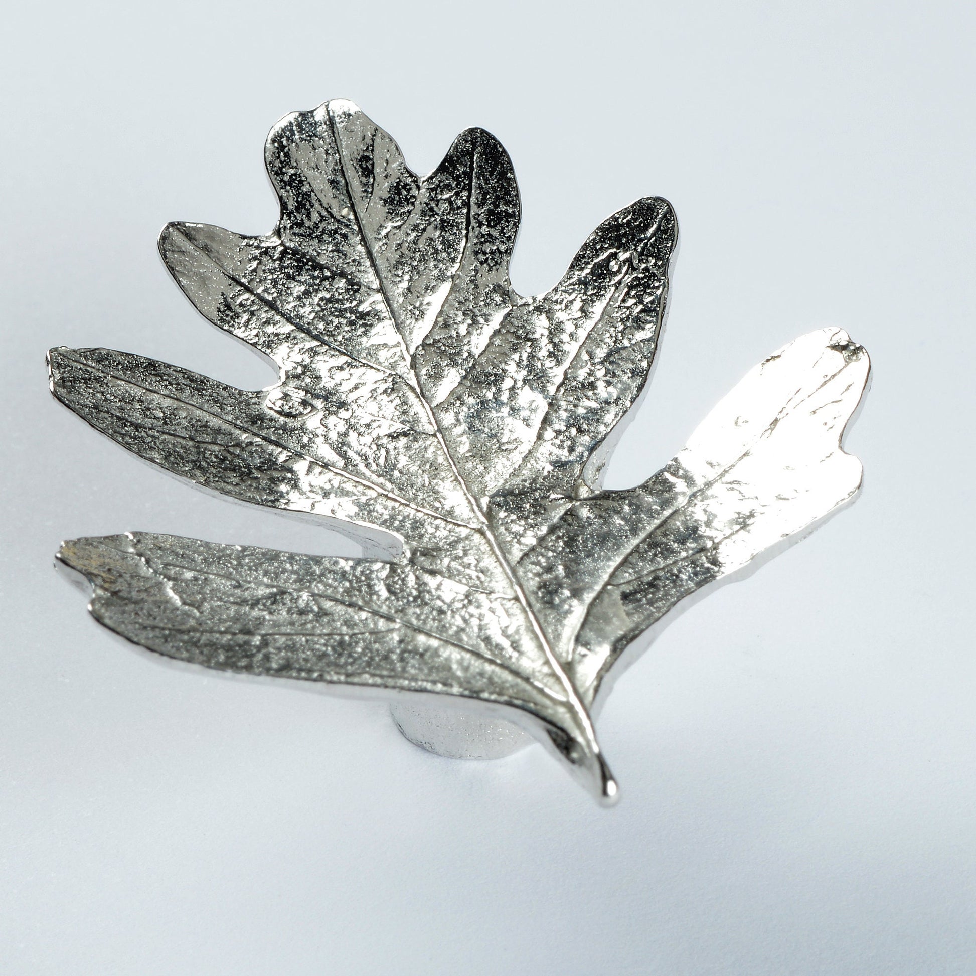 A solid pewter cabinet handle, cupboard knob, furniture handle or drawer pull in the shape of a detailed hawthorn leaf. Organic, unusual handles UK handmade with finesse