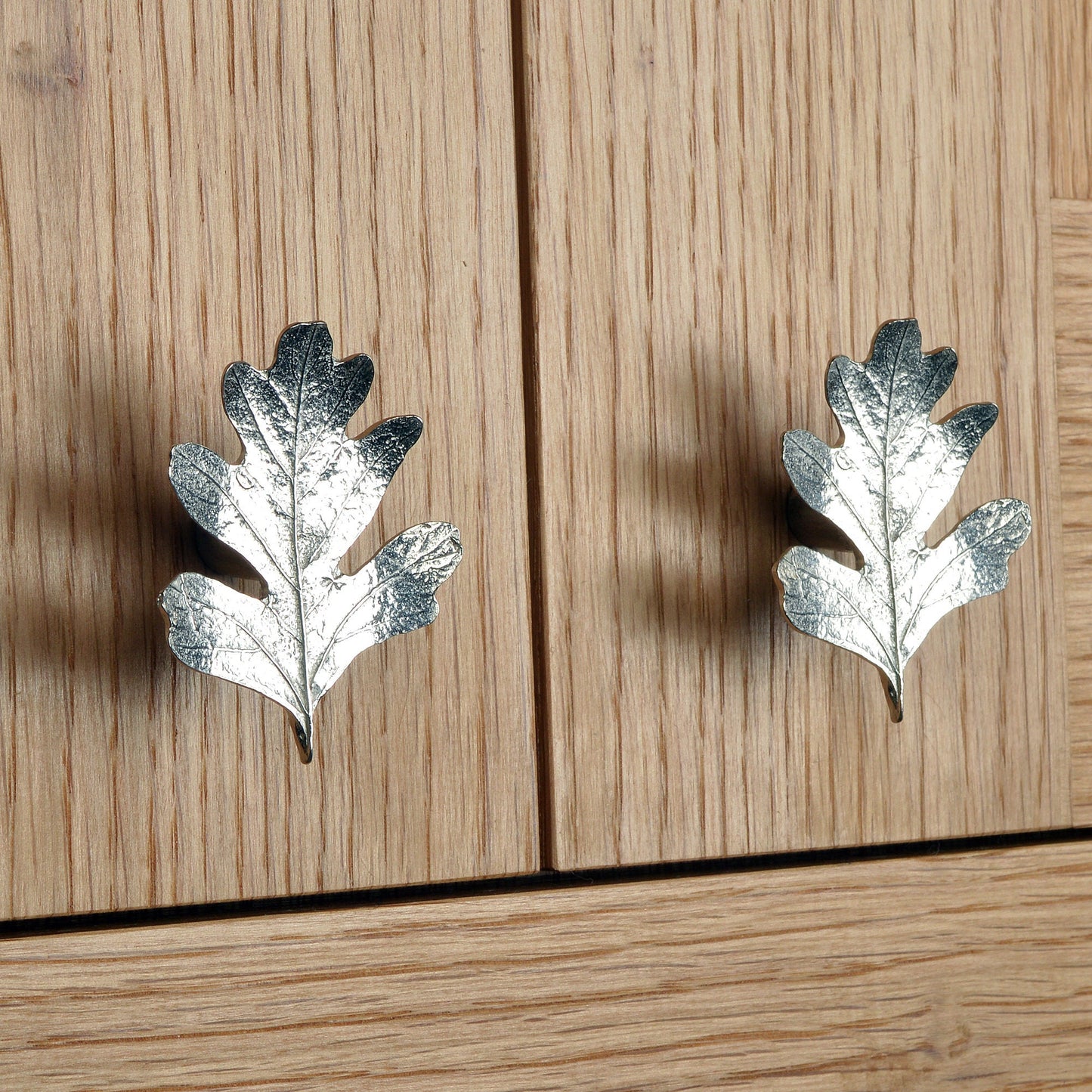 A solid pewter cabinet handle, cupboard knob, furniture handle or drawer pull in the shape of a detailed hawthorn leaf. Organic, unusual handles UK handmade with finesse