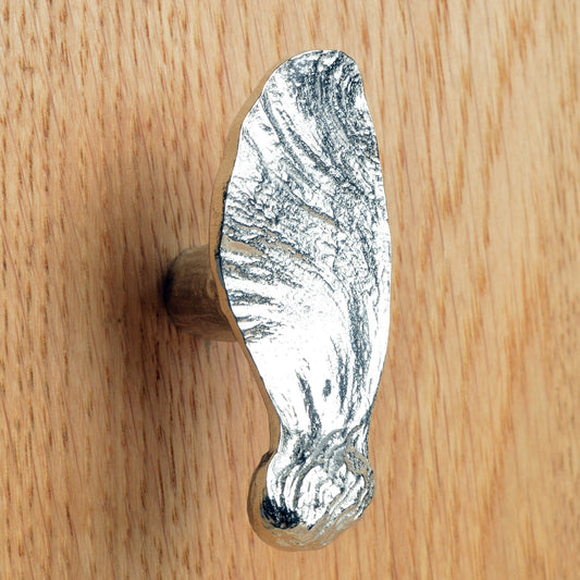 A solid pewter cabinet handle, cupboard knob, furniture handle or drawer pull in the shape of a detailed maple key, maple seed pod. Organic, unusual handles UK handmade with finesse