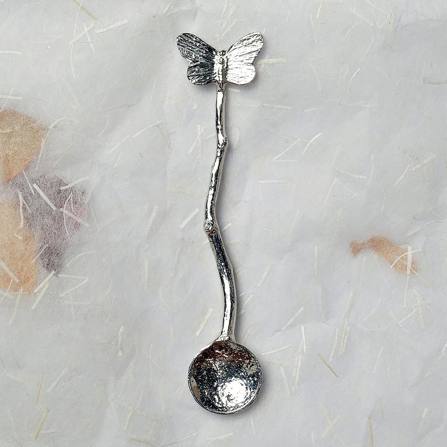 a tiny spice, salt or condiment spoon. Our pewter spoon has a small 10mm bowl leading up a fine twig textured handle to a small butterfly sculpture. Butterfly gifts for butterfly lovers