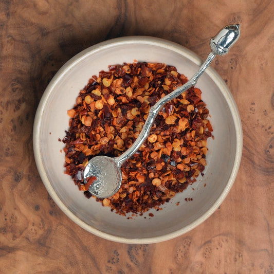 a tiny spice, salt or condiment spoon. Our pewter spoon has a small 10mm bowl leading up a fine twig textured handle to a small acorn. From little acorns gifts