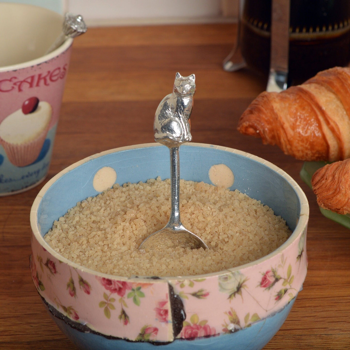 A small spoon pewter sugar spoon. A round bowled spoon on a straight handle leads to a perfectly sculpted cat. Practical & useful cat gifts for cat lovers. UK handmade