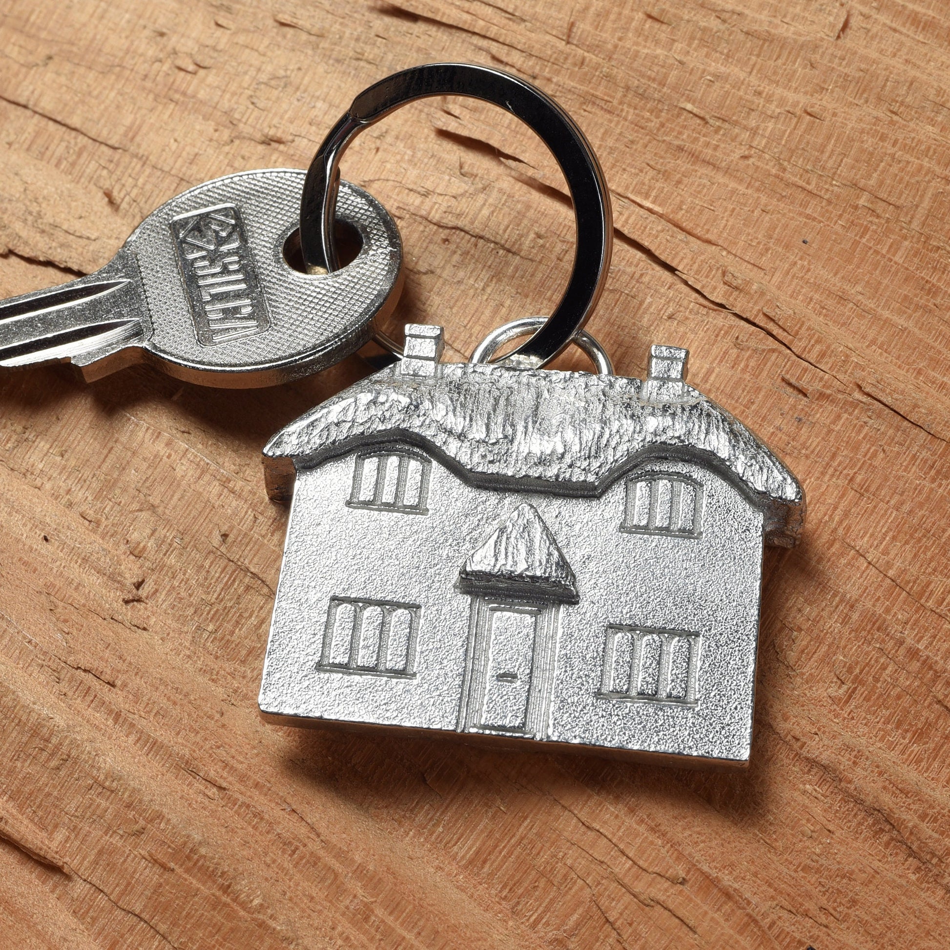 A solid pewter thatched cottage keyring on a quality stainless steel ring. Country gifts, new home gifts, useful gifts, housewarming gifts, handmade in the UK