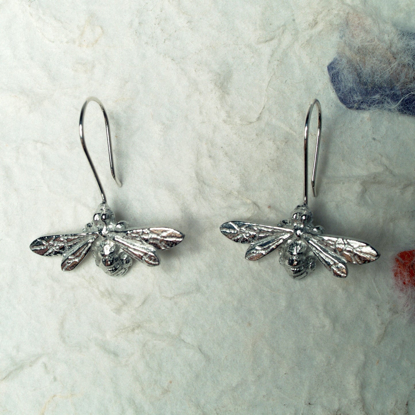 Bee drop earrings, pewter bees on Sterling silver ear hooks. Pewter and silver bee jewellery gifts, handmade in the UK by Glover and Smith