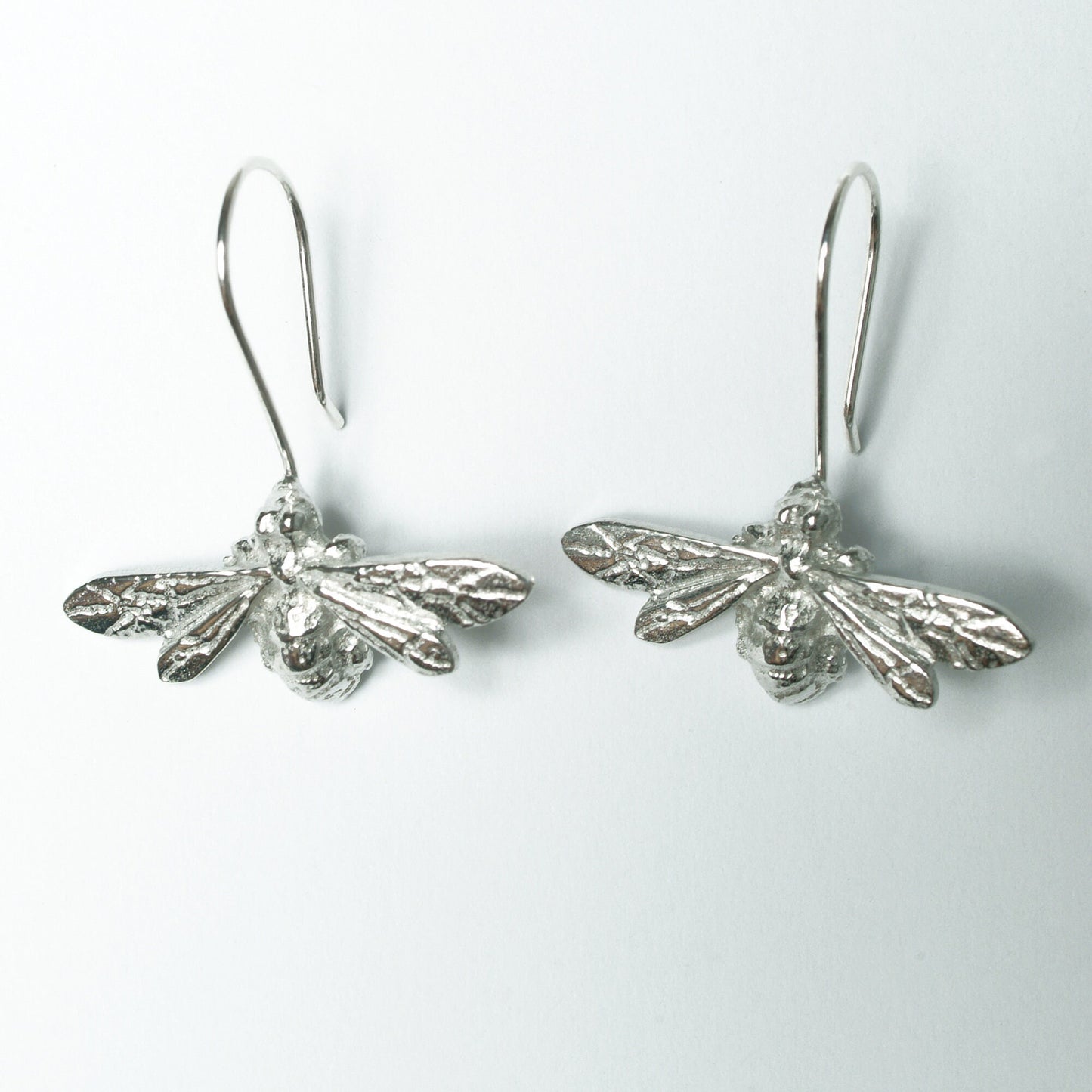 Bee drop earrings, pewter bees on Sterling silver ear hooks. Pewter and silver bee jewellery gifts, handmade in the UK by Glover and Smith