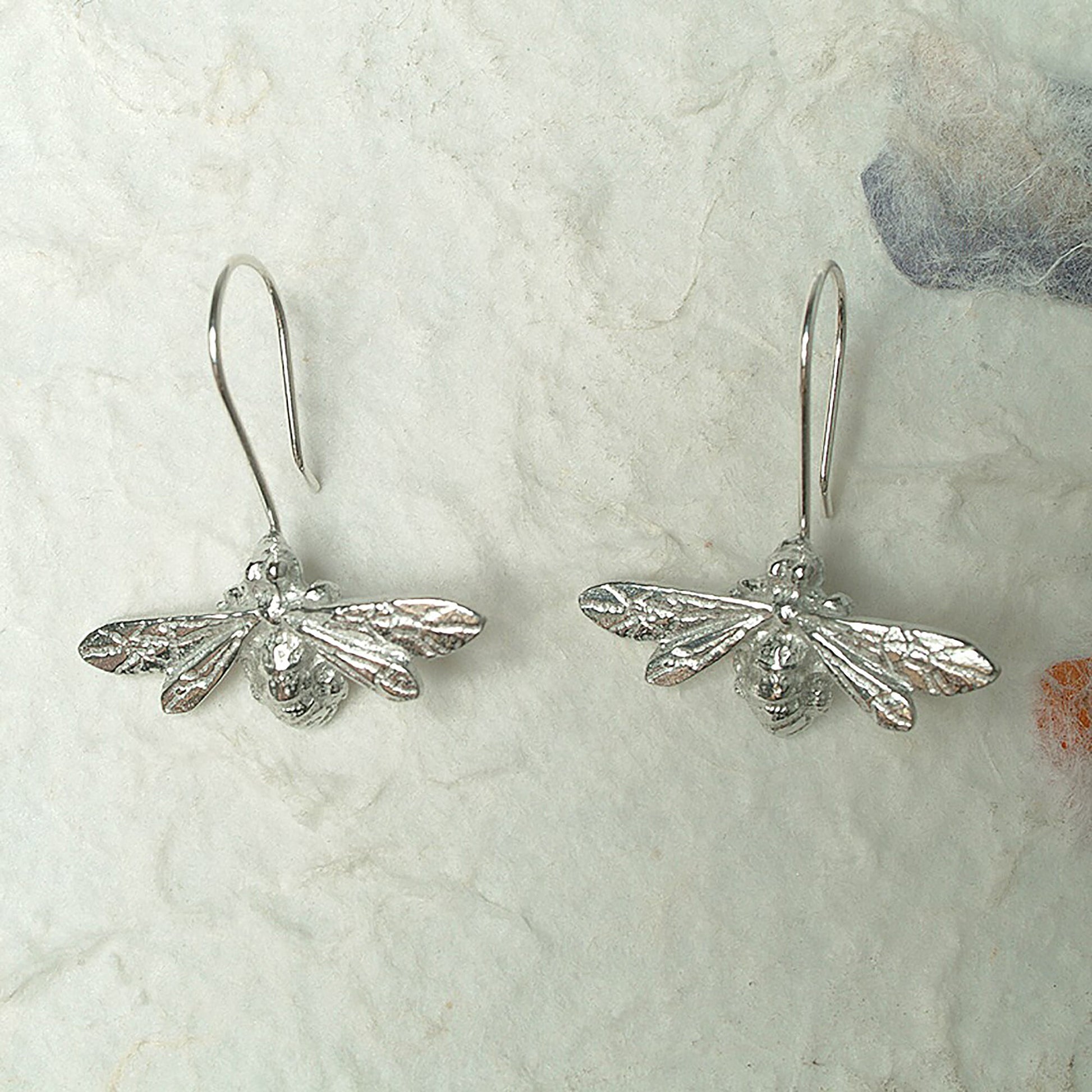 Bee drop earrings, pewter bees on Sterling silver ear hooks. Pewter and silver bee jewellery gifts, handmade in the UK by Glover and Smith