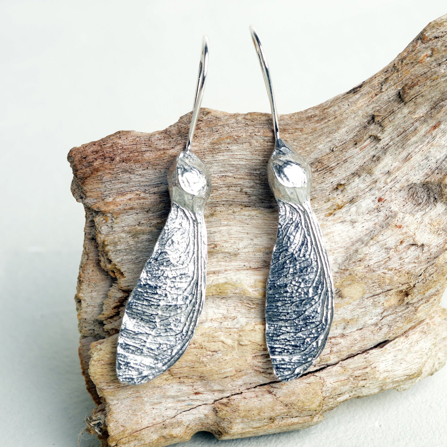 Sycamore key drop earrings, pewter sycamore keys on Sterling silver ear hooks. Pewter and silver sycamore key jewellery gifts, handmade in the UK by Glover and Smith