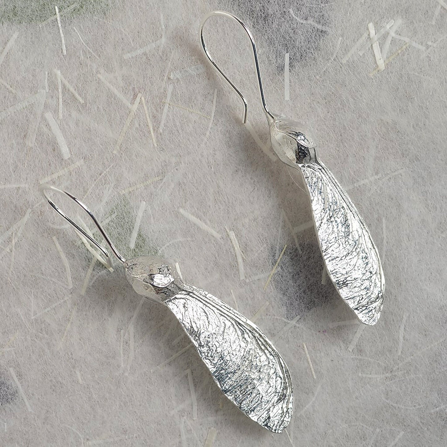 Sycamore key drop earrings, pewter sycamore keys on Sterling silver ear hooks. Pewter and silver sycamore key jewellery gifts, handmade in the UK by Glover and Smith