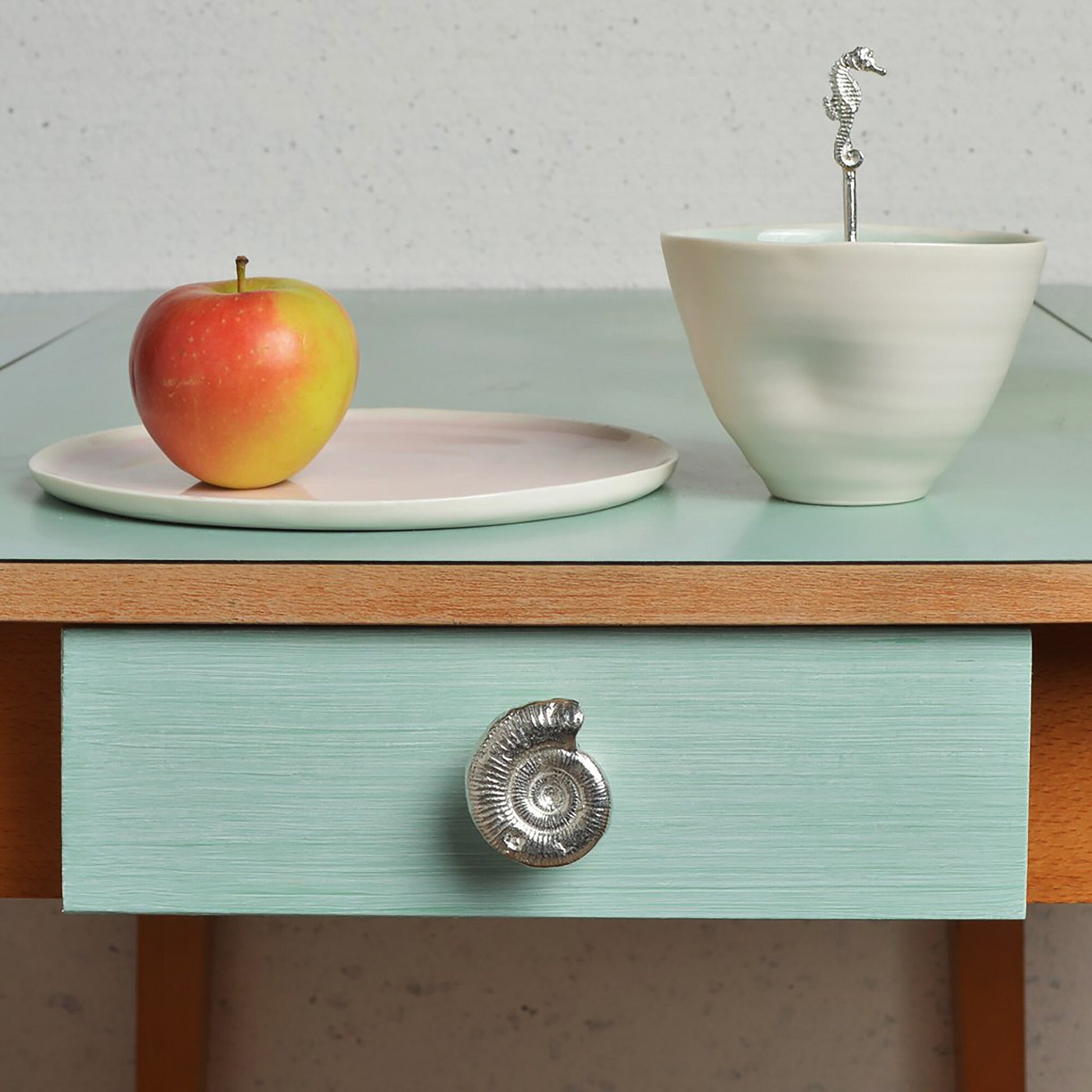 A solid pewter cabinet handle, cupboard knob, furniture handle or drawer pull in the shape of a detailed ammonite fossil. Organic, unusual handles UK handmade with finesse